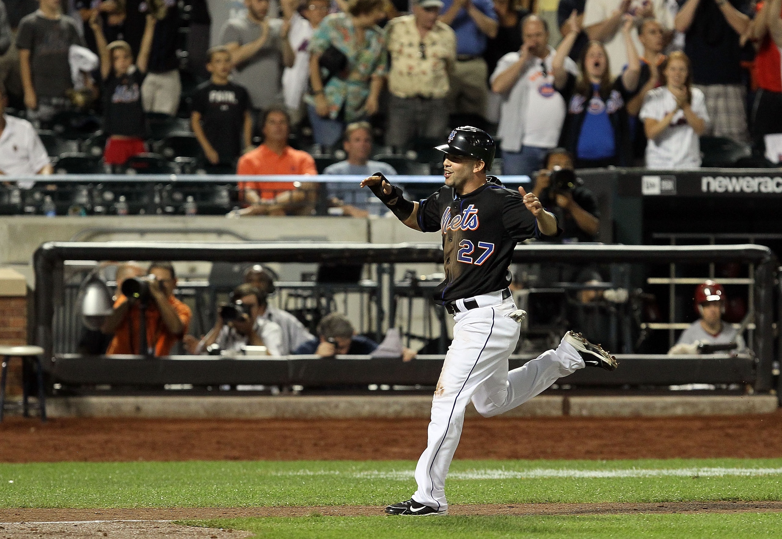 NEW YORK - JULY 31:  Jesus Feliciano #27 of the New York Mets scores the winning run in the ninth inning against the Arizona Diamondbacks on a sacrifice fly from teammate Carlos Beltran (not pictured) on July 31, 2010 at Citi Field in the Flushing neighbo