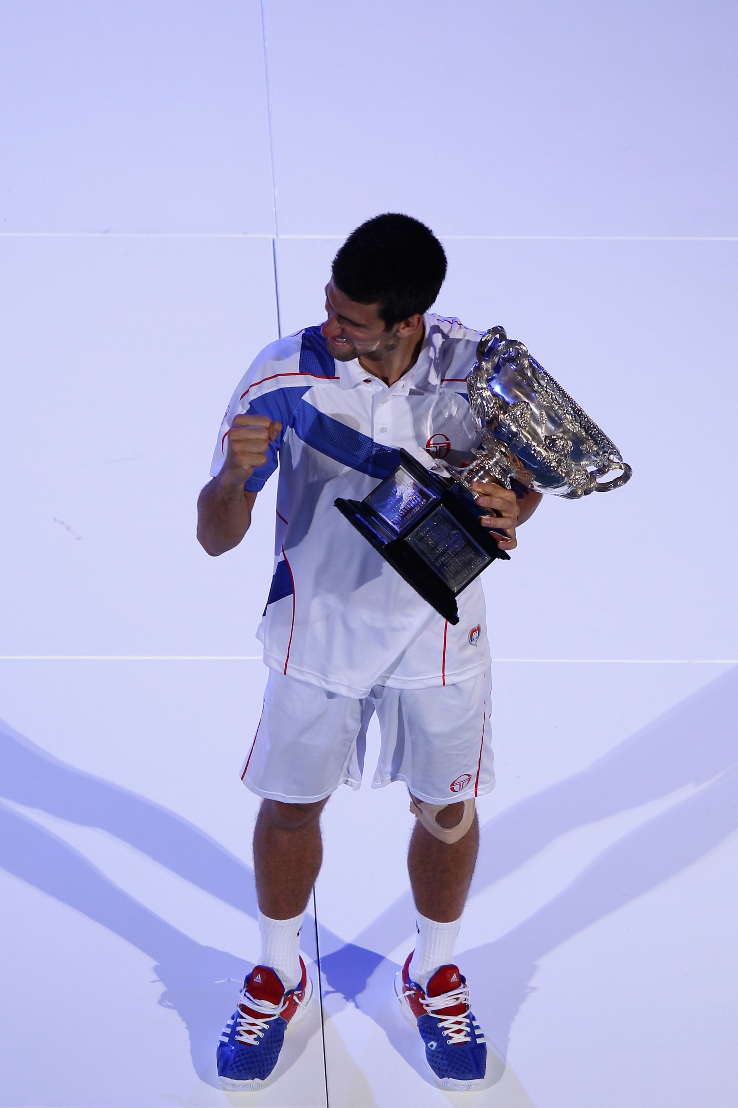 MELBOURNE, AUSTRALIA - JANUARY 30:  Novak Djokovic of Serbia holds the Norman Brookes Challenge Cup after winning his men's final match against Andy Murray of Great Britain during day fourteen of the 2011 Australian Open at Melbourne Park on January 30, 2