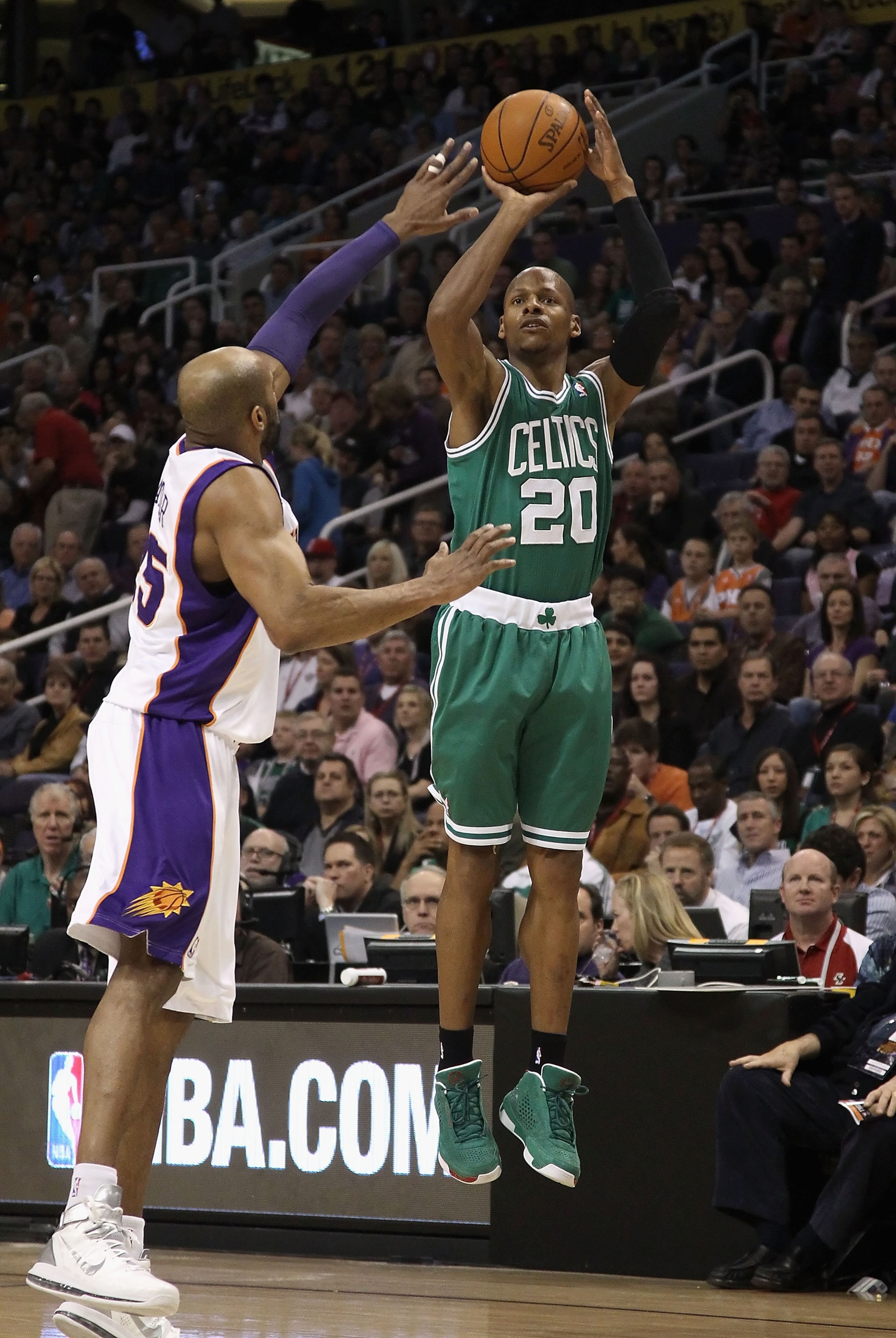 PHOENIX, AZ - JANUARY 28:  Ray Allen #20 of the Boston Celtics attempts a three point shot over Vince Carter #25 of the Phoenix Suns during the NBA game at US Airways Center on January 28, 2011 in Phoenix, Arizona. The Suns defeated the Celtics 88-71.  NO