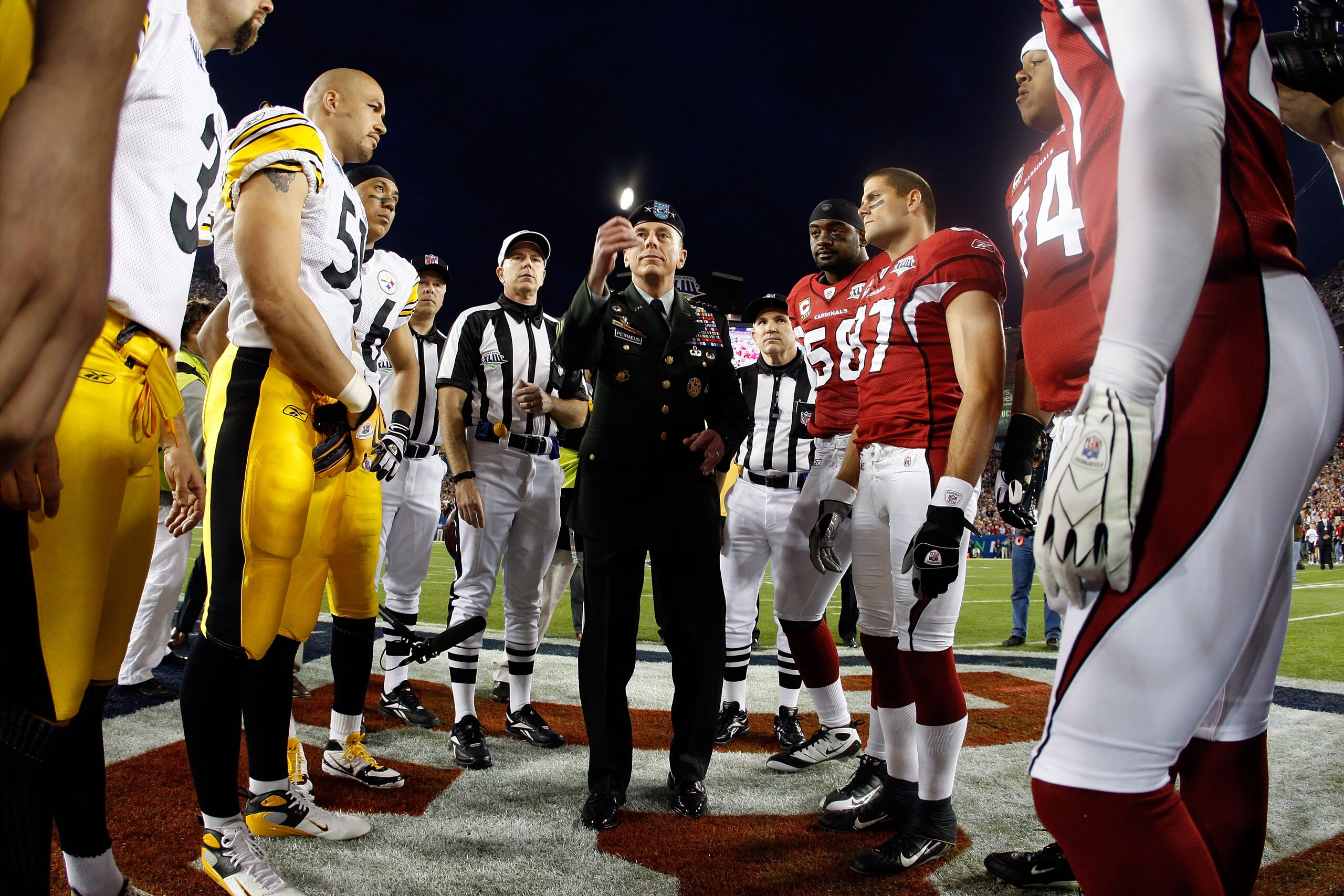 TAMPA, FL - FEBRUARY 01:  General David H. Petraeus, commander of the United States Central Command, performs the coin toss before Super Bowl XLIII between the Arizona Cardinals and the Pittsburgh Steelers on February 1, 2009 at Raymond James Stadium in T