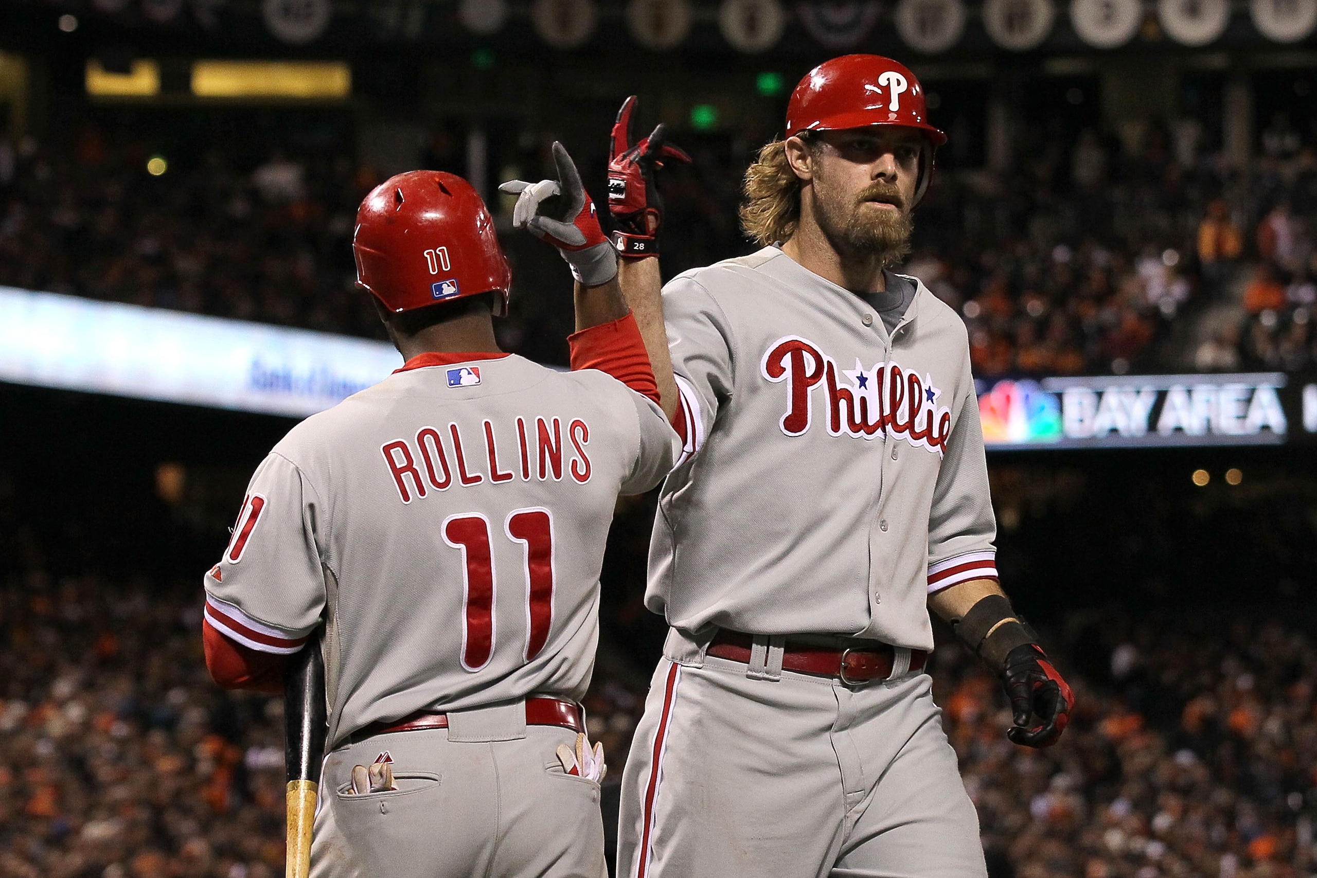 SAN FRANCISCO - OCTOBER 21:  Jayson Werth #28 of the Philadelphia Phillies celebrates a solo homerun against the San Francisco Giants with teammate Jimmy Rollins #11 in the ninth inning of Game Five of the NLCS during the 2010 MLB Playoffs at AT&T Park on