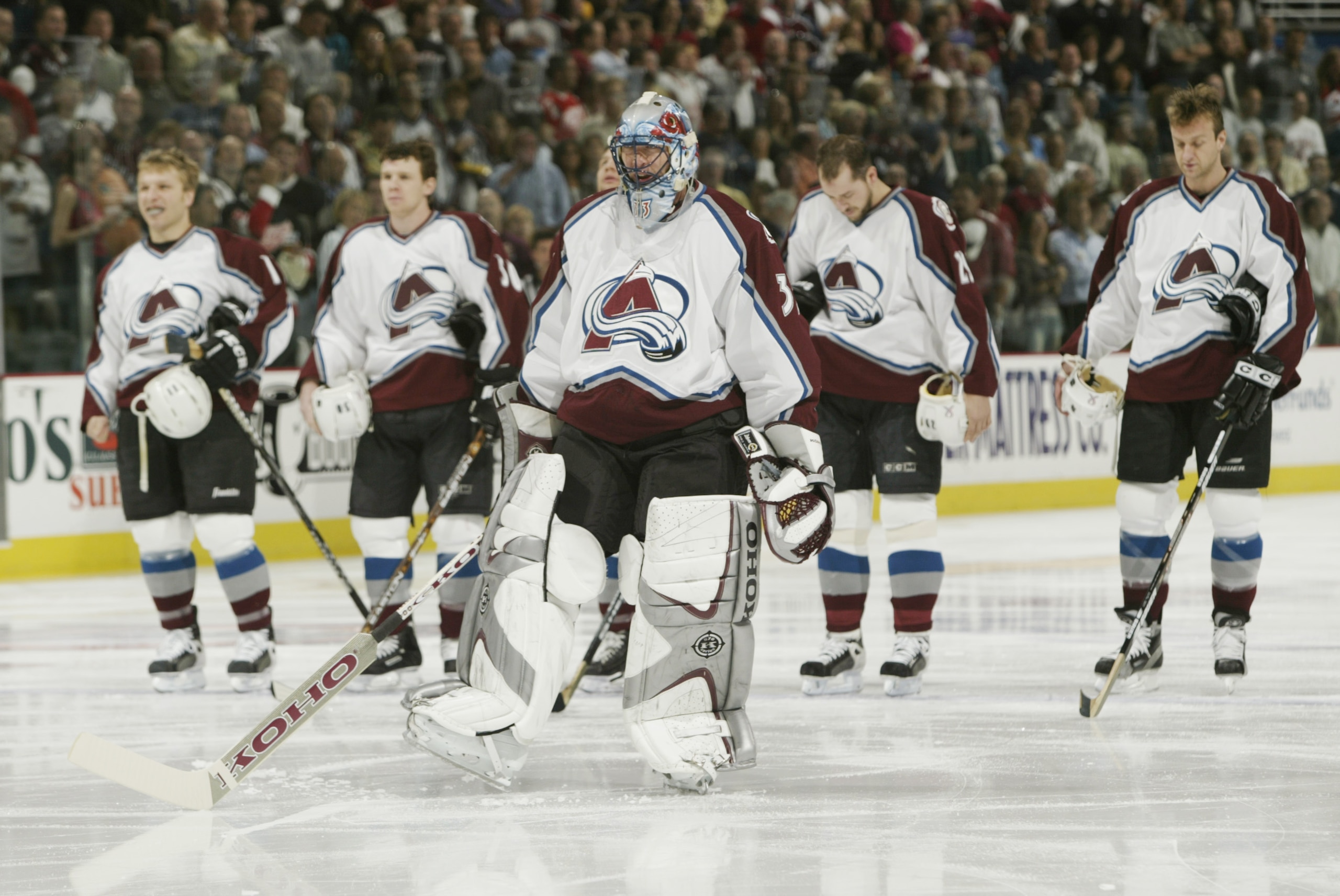 DENVER - MAY 25:   Goalie Patrick Roy #33 of the Colorado Avalanche stands with teammates for the National Anthem before the game against the Detroit Red Wings in game four of the Western Conference finals in the Stanley Cup playoffs at the Pepsi Center i