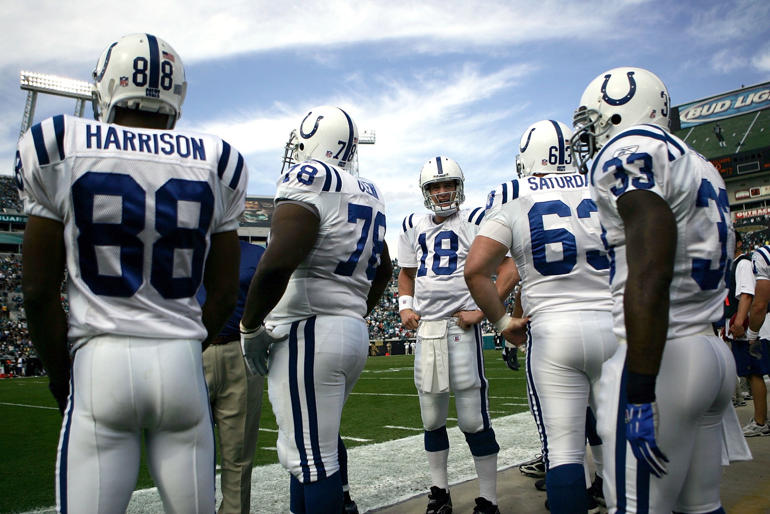 JACKSONVILLE, FL - DECEMBER 10:  Quarterback Peyton Manning #18 of the Indianapolis Colts stands on the sidelines with teammates prior to a game against the Jacksonville Jaguars on December 10, 2006 at Alltel Stadium in Jacksonville, Florida.  (Photo by M