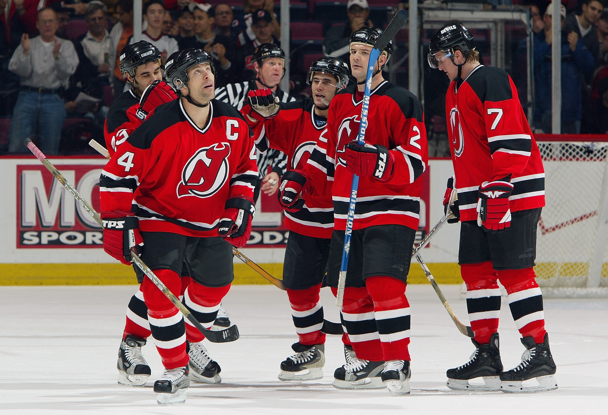 EAST RUTHERFORD, NJ - NOVEMBER19:  Defender Scott Stevens #4 of the New Jersey Devils huddles with his team during the game against the Buffalo Sabres at the Continental Airlines Arena on November 19, 2003 in East Rutherford, New Jersey.  The Devils won 4
