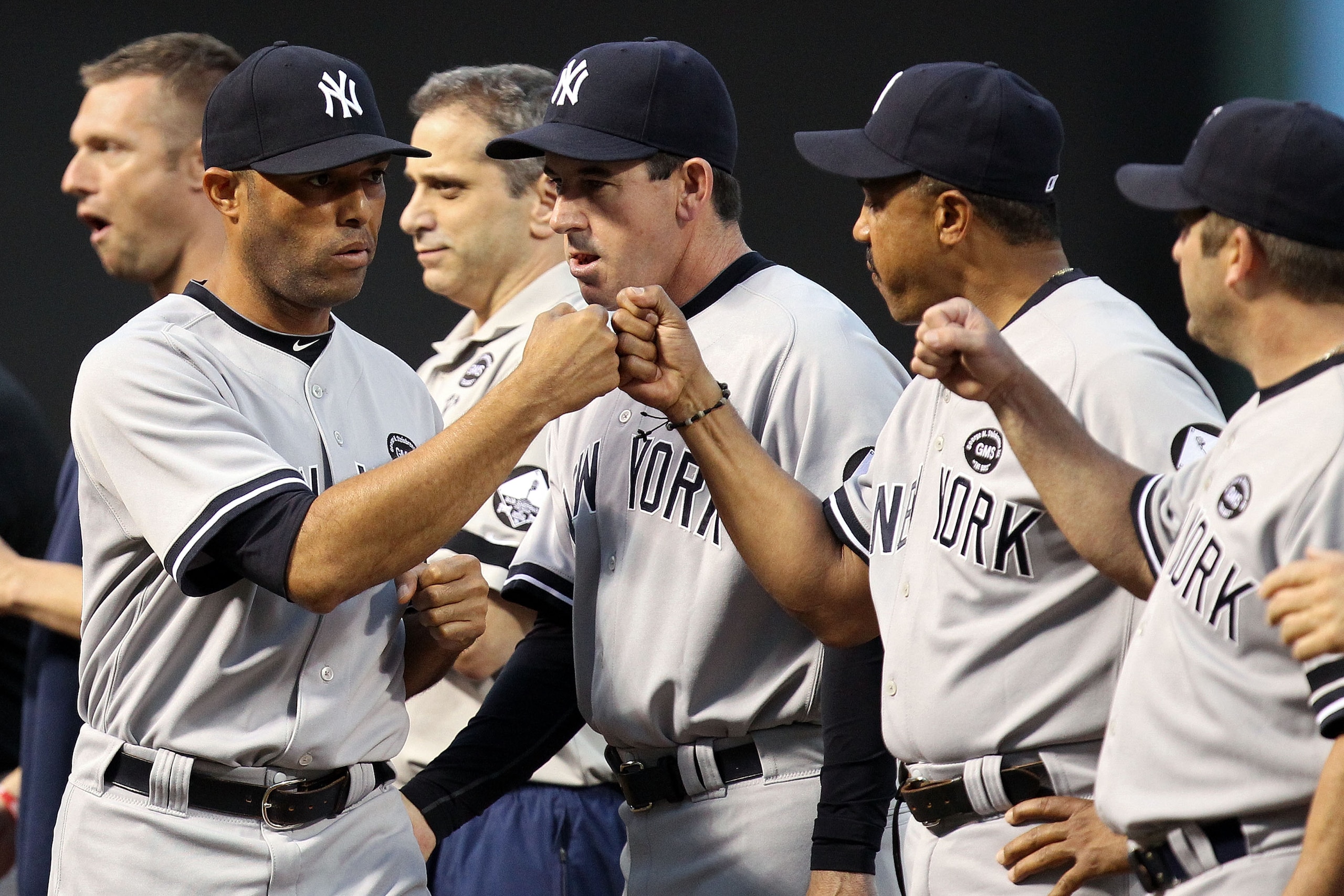 ARLINGTON, TX - OCTOBER 15:  Mariano Rivera #42 of the New York Yankees greets his team before playing against the Texas Rangers in Game One of the ALCS during the 2010 MLB Playoffs at Rangers Ballpark in Arlington on October 15, 2010 in Arlington, Texas.