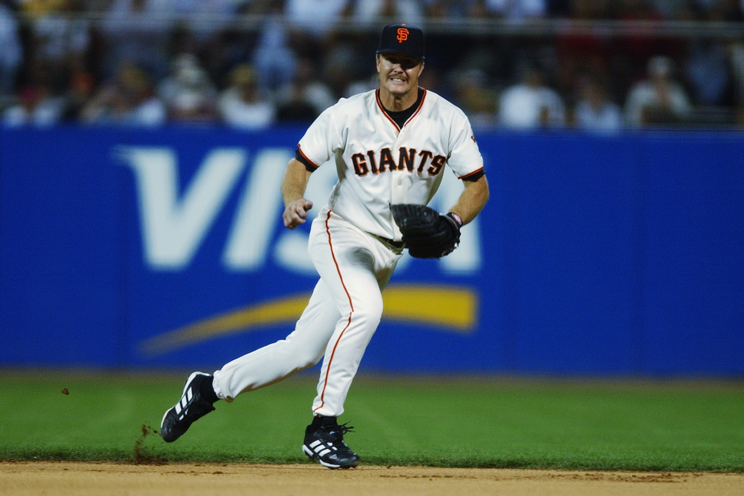 SAN FRANCISCO - OCTOBER 6:  Jeff Kent #21 of the San Francisco Giants goes for the ball during game three of the National League Western Division Series against the Atlanta Braves on October 6, 2002 at the Pacific Bell Park in San Francisco, California. T