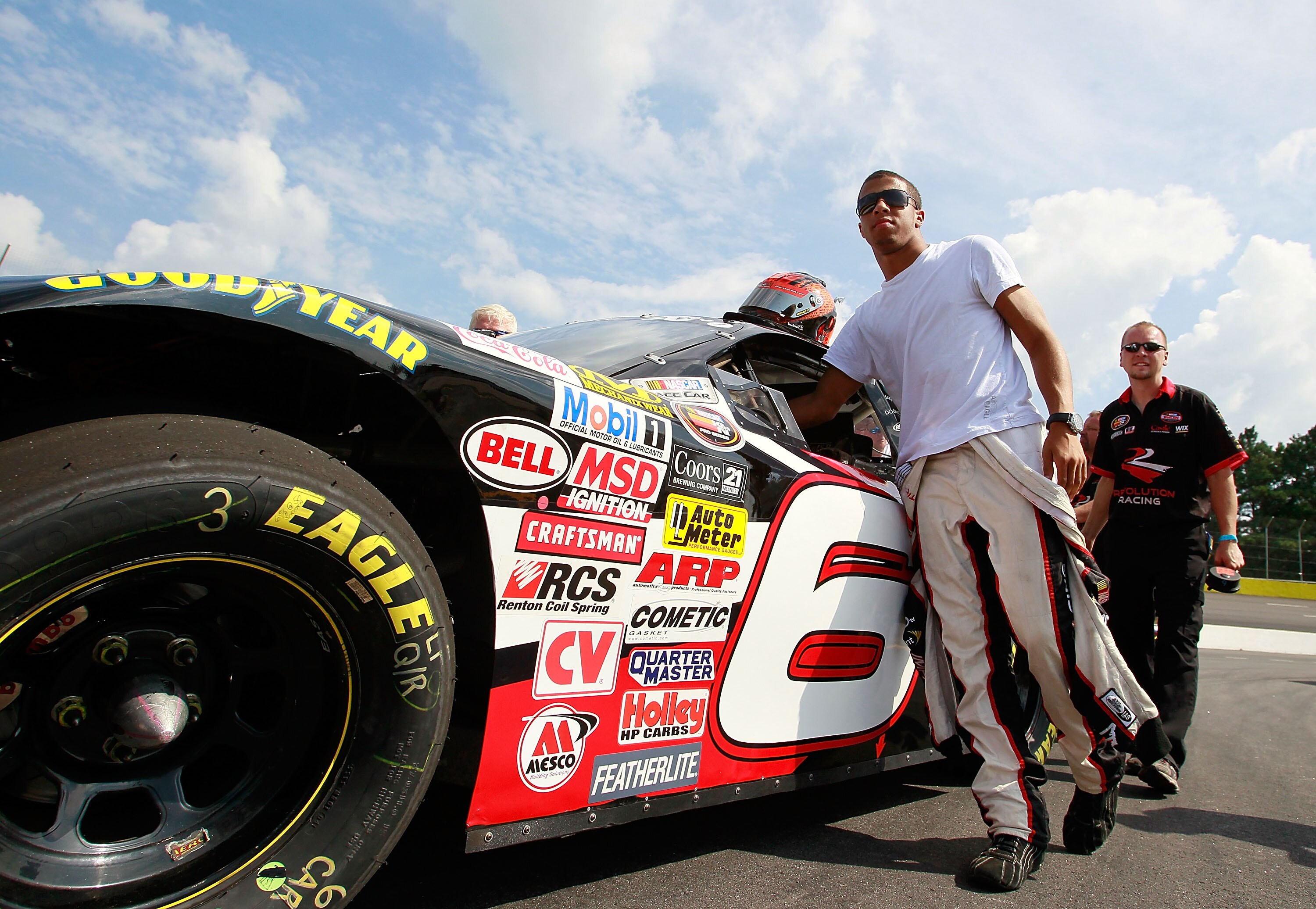 JEFFERSON, GA - AUGUST 28:  Darrell Wallace Jr., driver of the #6 Revolution Racing Chevrolet, helps push his car during qualifying for the NASCAR K&N Pro Series East at Gresham Motorsports Park on August 28, 2010 in Jefferson, Georgia.  (Photo by Kevin C
