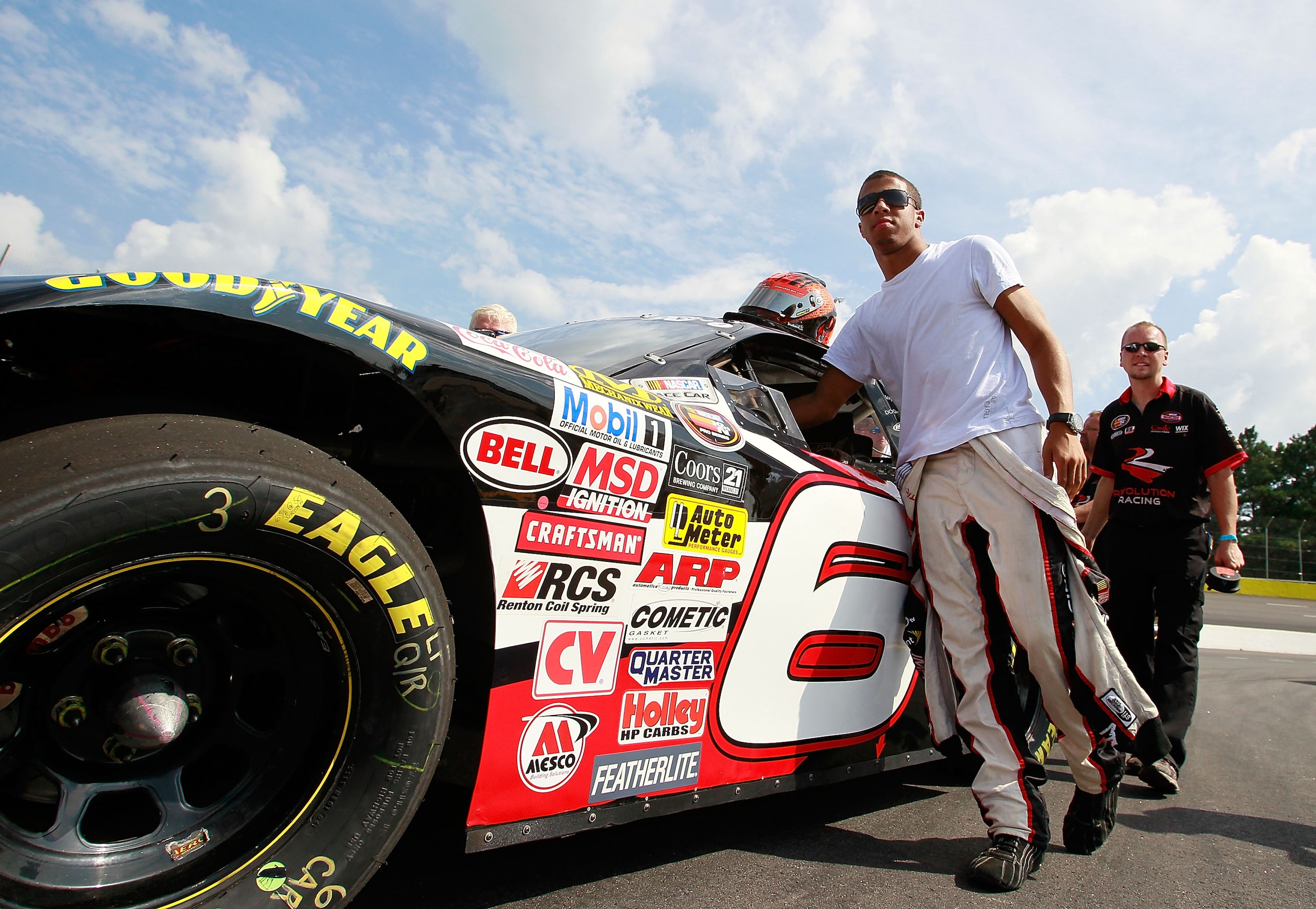 JEFFERSON, GA - AUGUST 28:  Darrell Wallace Jr., driver of the #6 Revolution Racing Chevrolet, helps push his car during qualifying for the NASCAR K&N Pro Series East at Gresham Motorsports Park on August 28, 2010 in Jefferson, Georgia.  (Photo by Kevin C