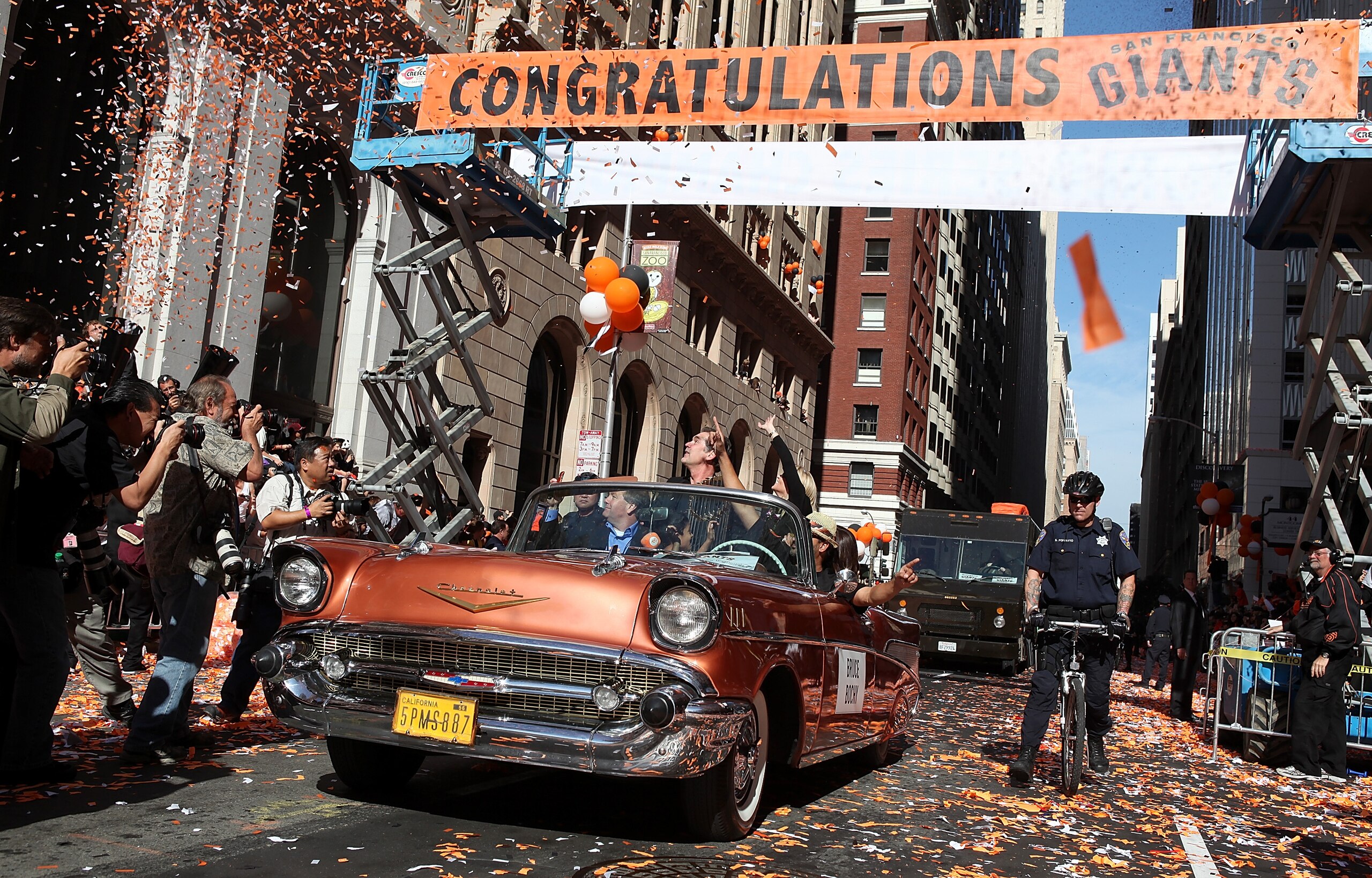 SAN FRANCISCO - NOVEMBER 03: San Francisco Giants manager Bruce Bochy rides in a vintage car during the Giants' vicotry parade on November 3, 2010 in San Francisco, California. Thousands of Giants fans lined the streets of San Francisco to watch the San SAN FRANCISCO - NOVEMBER 03: San Francisco Giants manager Bruce Bochy rides in a vintage car during the Giants' vicotry parade on November 3, 2010 in San Francisco, California. Thousands of Giants fans lined the streets of San Francisco to watch the San