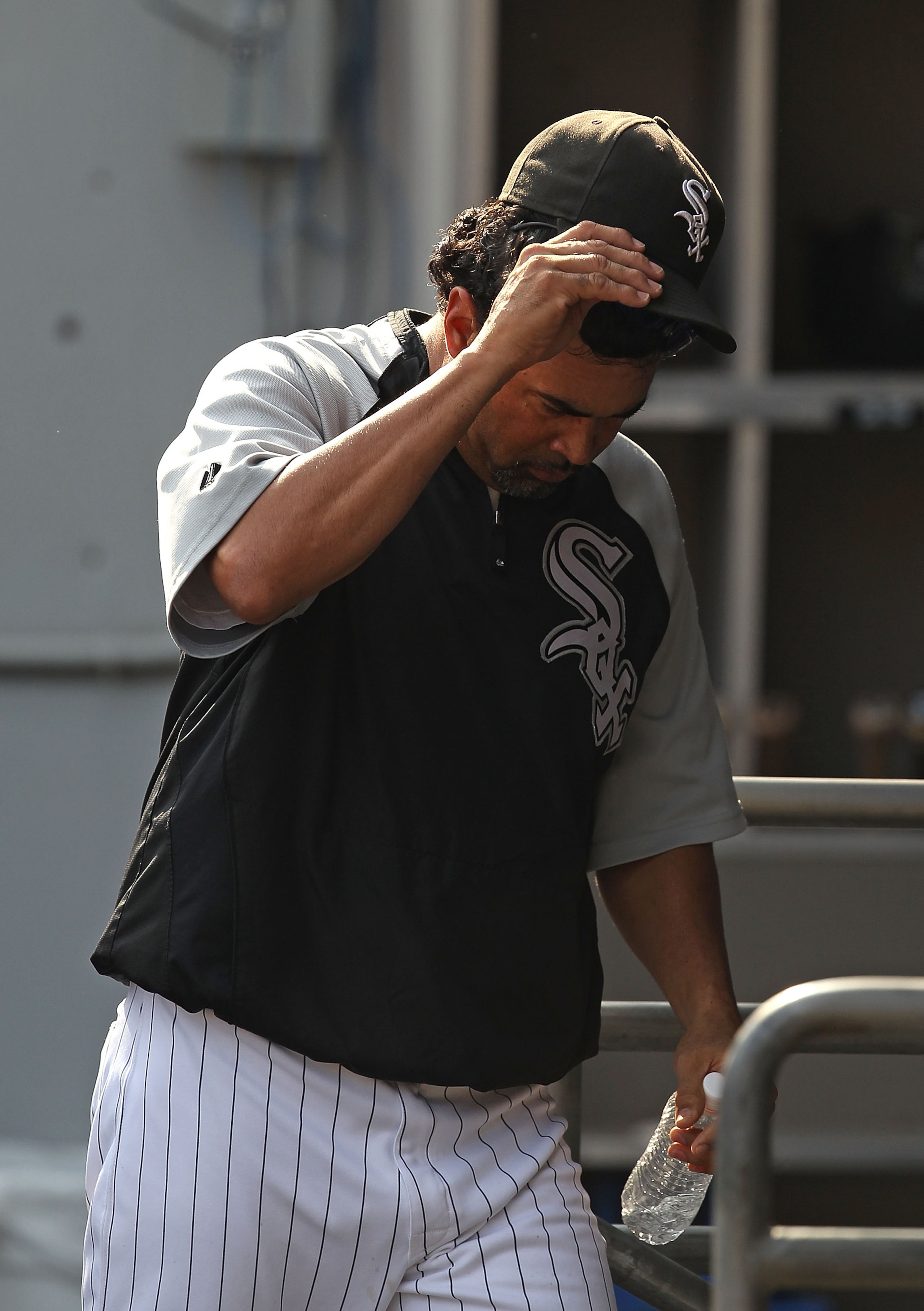 CHICAGO - AUGUST 29: Manager Ozzie Guillen #13 of the Chicago White Sox heads to the locker room after being thrown out of a game against the New York Yankees in the 9th inning at U.S. Cellular Field on August 29, 2010 in Chicago, Illinois. The Yankees de
