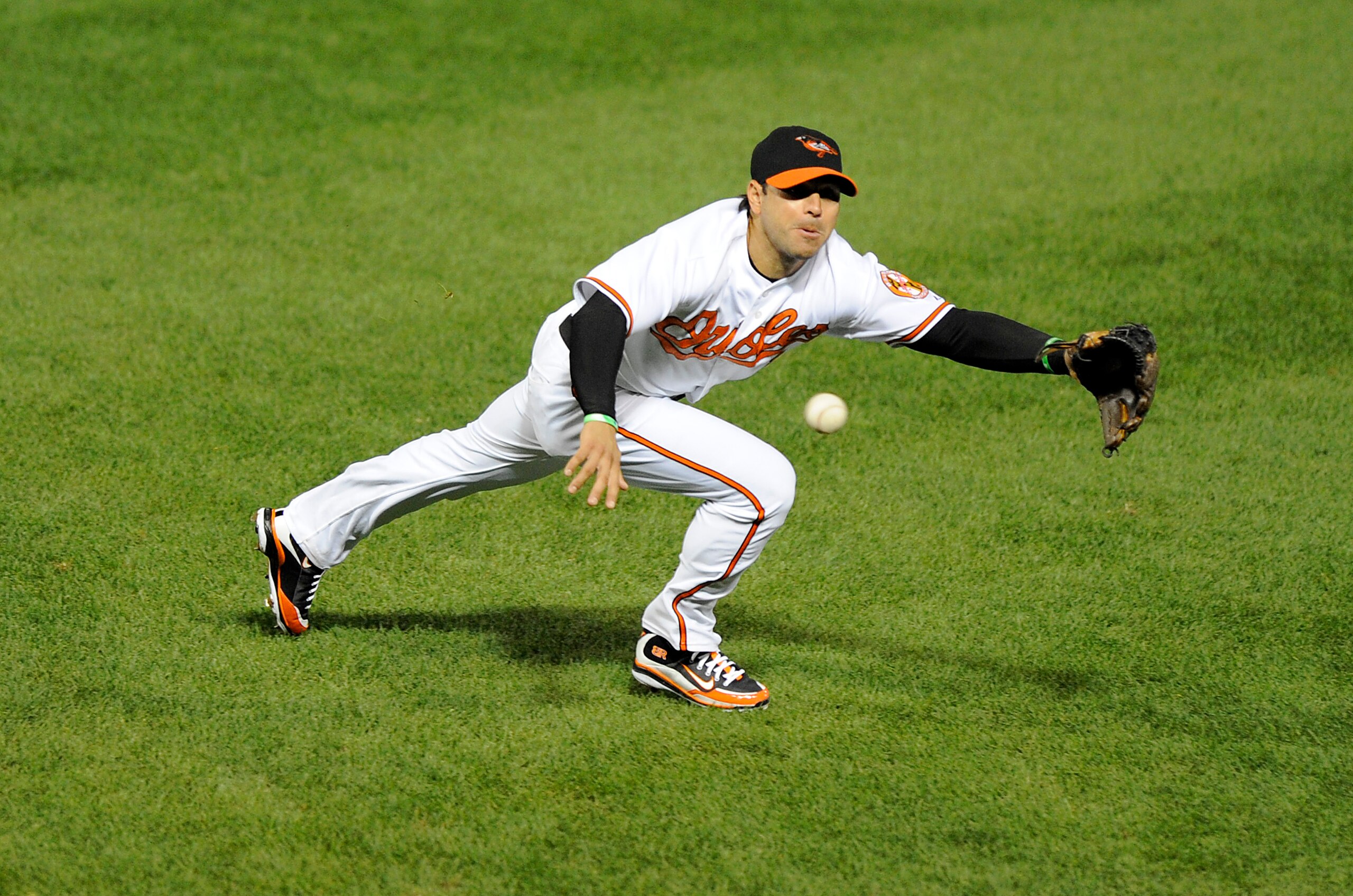 BALTIMORE - AUGUST 31:   Brian Roberts #1 of the Baltimore Orioles dives for a ball during the game against the New York Yankees on August 31, 2009 at Camden Yards in Baltimore, Maryland.  (Photo by Greg Fiume/Getty Images)