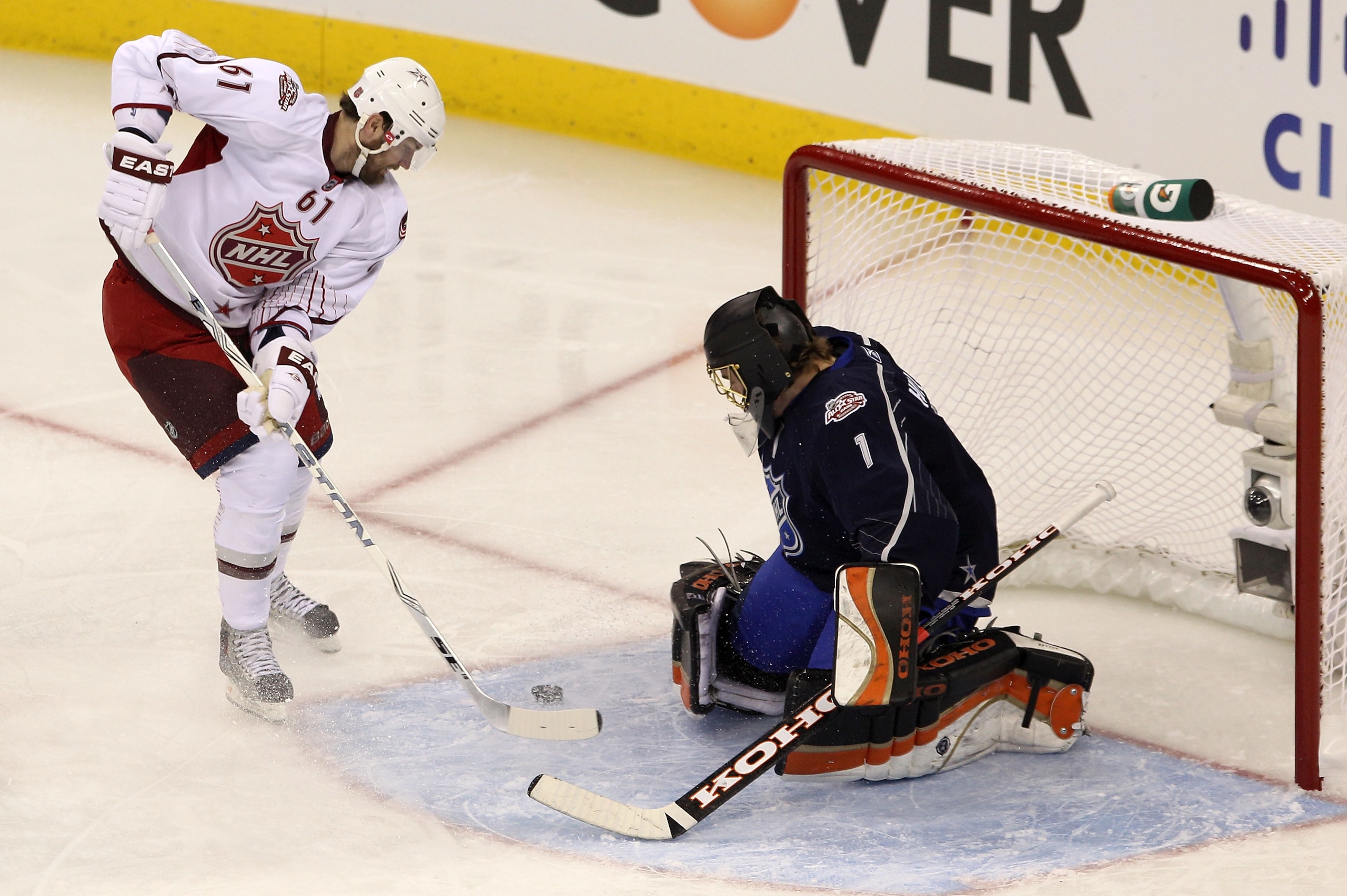 RALEIGH, NC - JANUARY 30:  Team Staal player Rick Nash #61 of the Columbus Blue Jackets takes a shot on Jonas Hiller #1 of the Anaheim Ducks and Team Lidstrom during the second period of the 58th NHL All-Star Game at RBC Center on January 30, 2011 in Rale