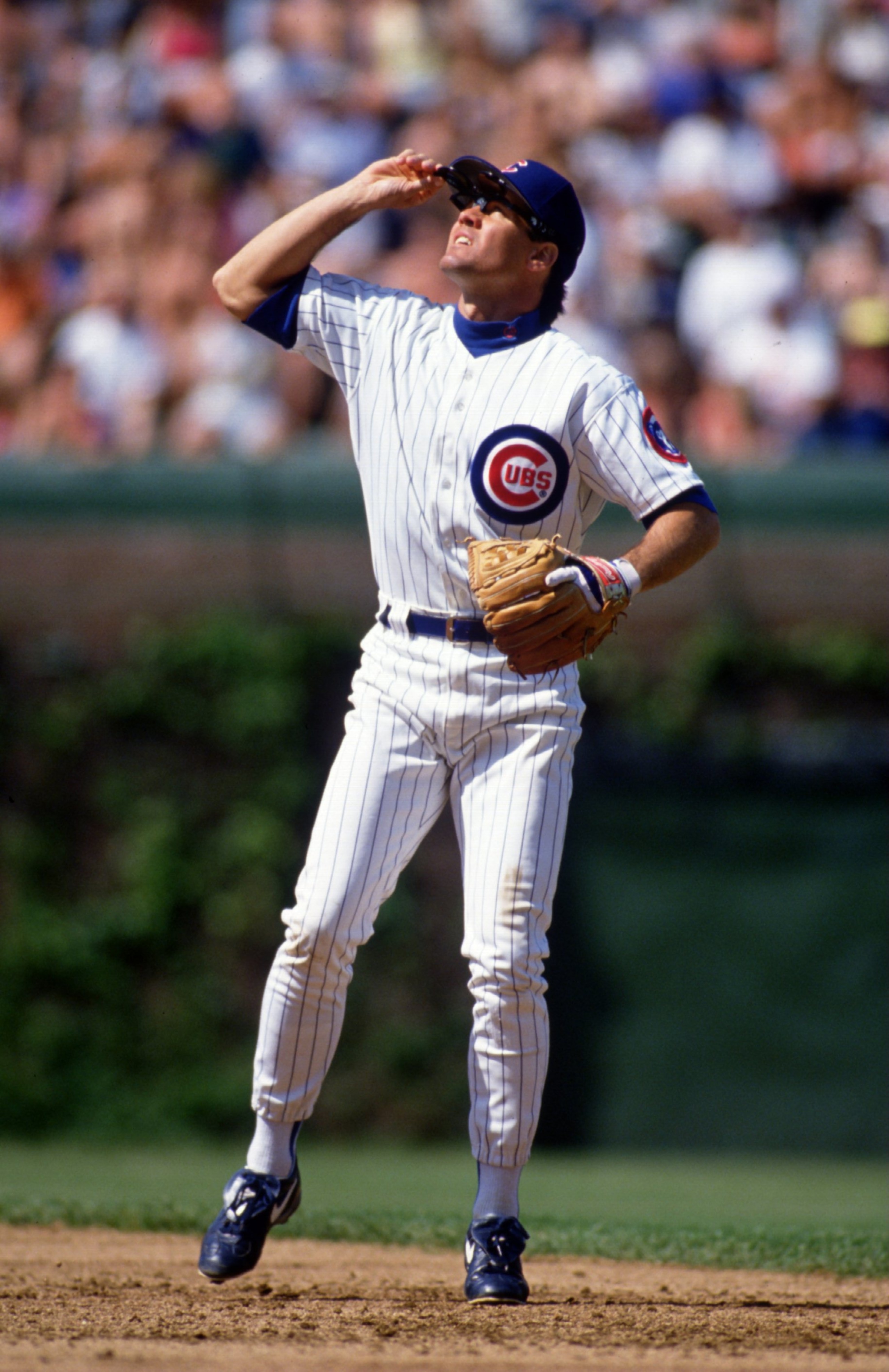 CHICAGO - MAY 20:  Second Baseman Ryne Sandberg of the Chicago Cubs looks into the sun as he watches for an infield fly ball during a game against the San Francisco Giants on May 20, 1994 at Wrigley Field in Chicago, Illinois (Photo by Jonathan Daniel/Get
