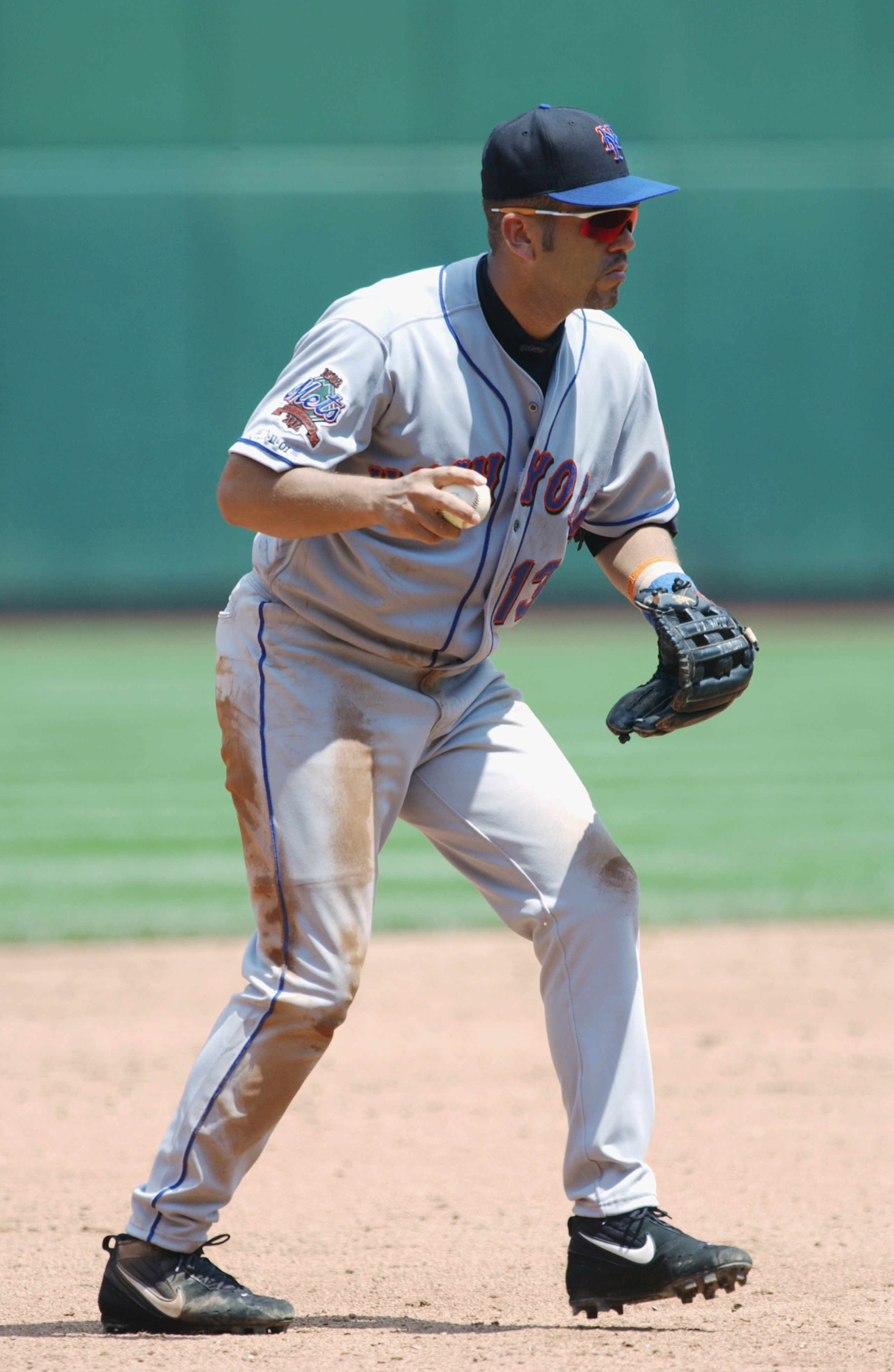 CINCINNATI - JULY 21:  Third baseman Edgardo Alfonzo #13 of the New York Mets pops up with a ground ball during the MLB game against the Cincinnati Reds on July 21, 2002  at Cinergy Field in Cincinnati, Ohio.  The Reds defeated the Mets 9-1. (Photo By Mat