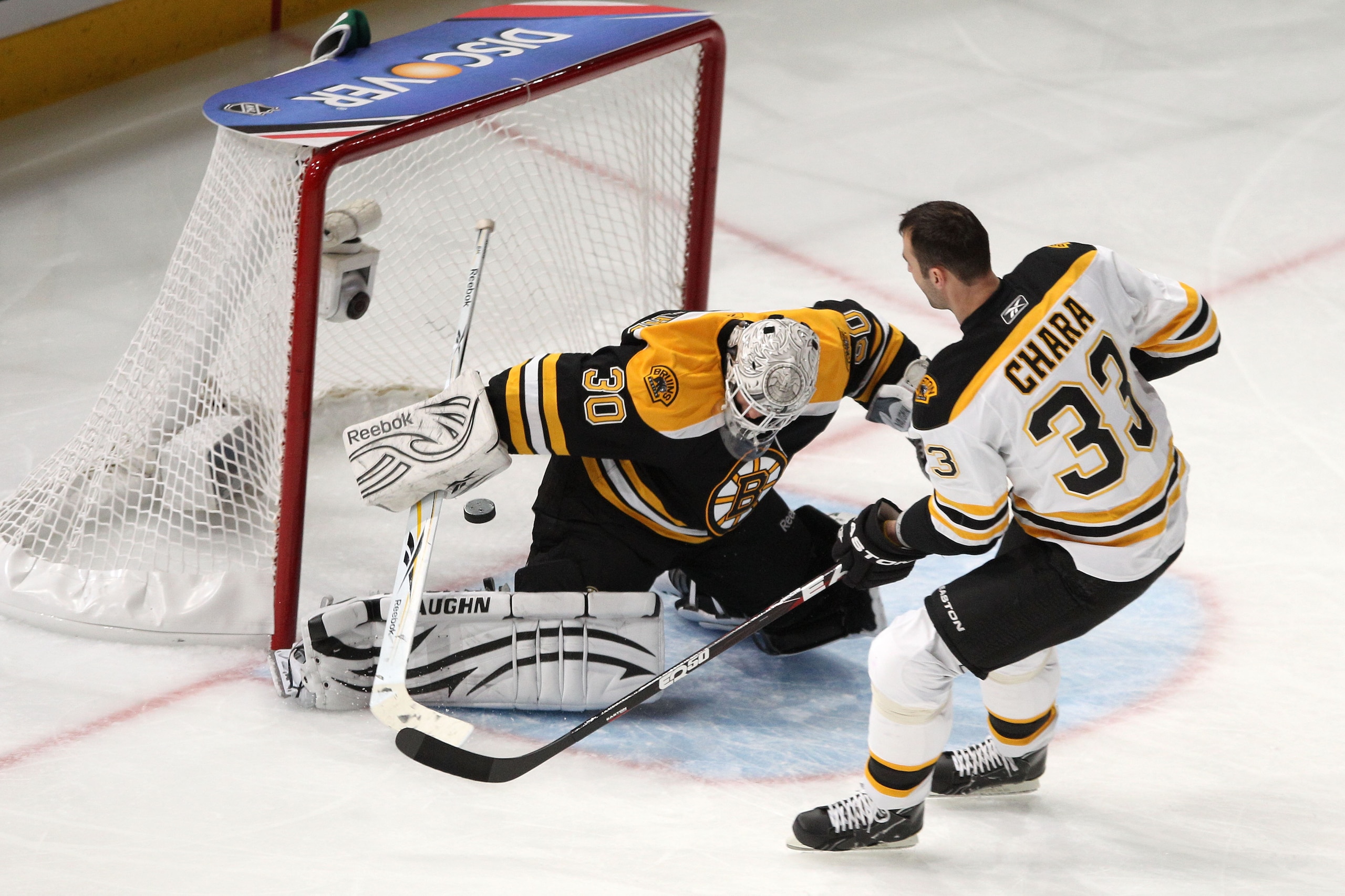 RALEIGH, NC - JANUARY 29:  Zdeno Chara #33 of the Boston Bruins shoots on Tim Thomas #30 of the Boston Bruins during the elimination shootout part of the Honda NHL SuperSkills competition part of 2011 NHL All-Star Weekend at the RBC Center on January 29,