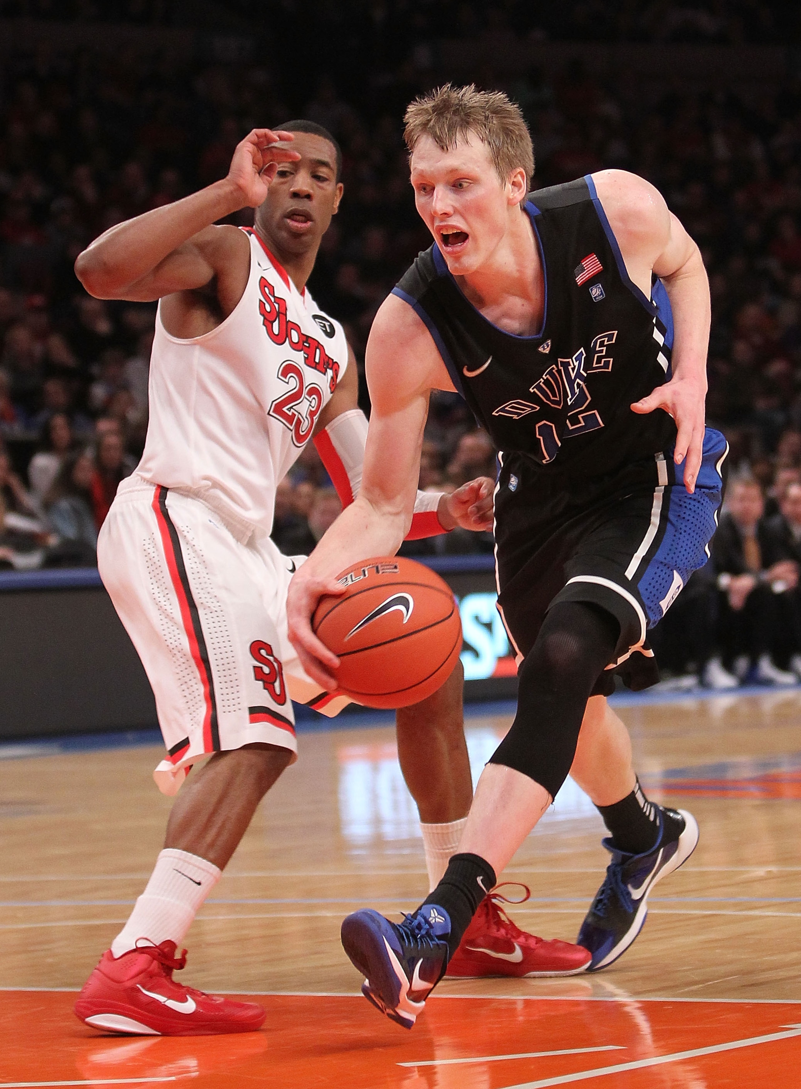 NEW YORK, NY - JANUARY 30: Kyle Singler #12 of the Duke Blue Devils dribbles the ball past Paris Horne #23 of the St. John's Red Storm at Madison Square Garden on January 30, 2011 in New York City. (Photo by Nick Laham/Getty Images) NEW YORK, NY - JANUARY 30: Kyle Singler #12 of the Duke Blue Devils dribbles the ball past Paris Horne #23 of the St. John's Red Storm at Madison Square Garden on January 30, 2011 in New York City. (Photo by Nick Laham/Getty Images)