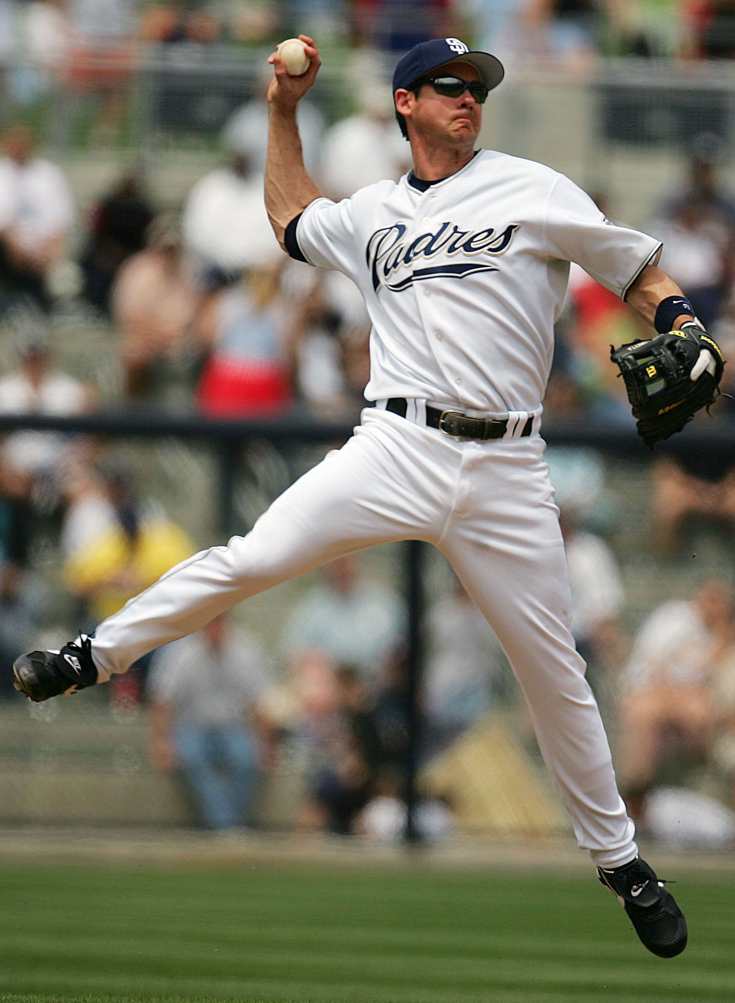 SAN DIEGO - MAY 4:  Second baseman Mark Loretta #8 of the San Diego Padres goes airborn to throw an out against the Colorado Rockies on May 4, 2005 at Petco Park in San Diego, California.  (Photo by Donald Miralle/Getty Images)