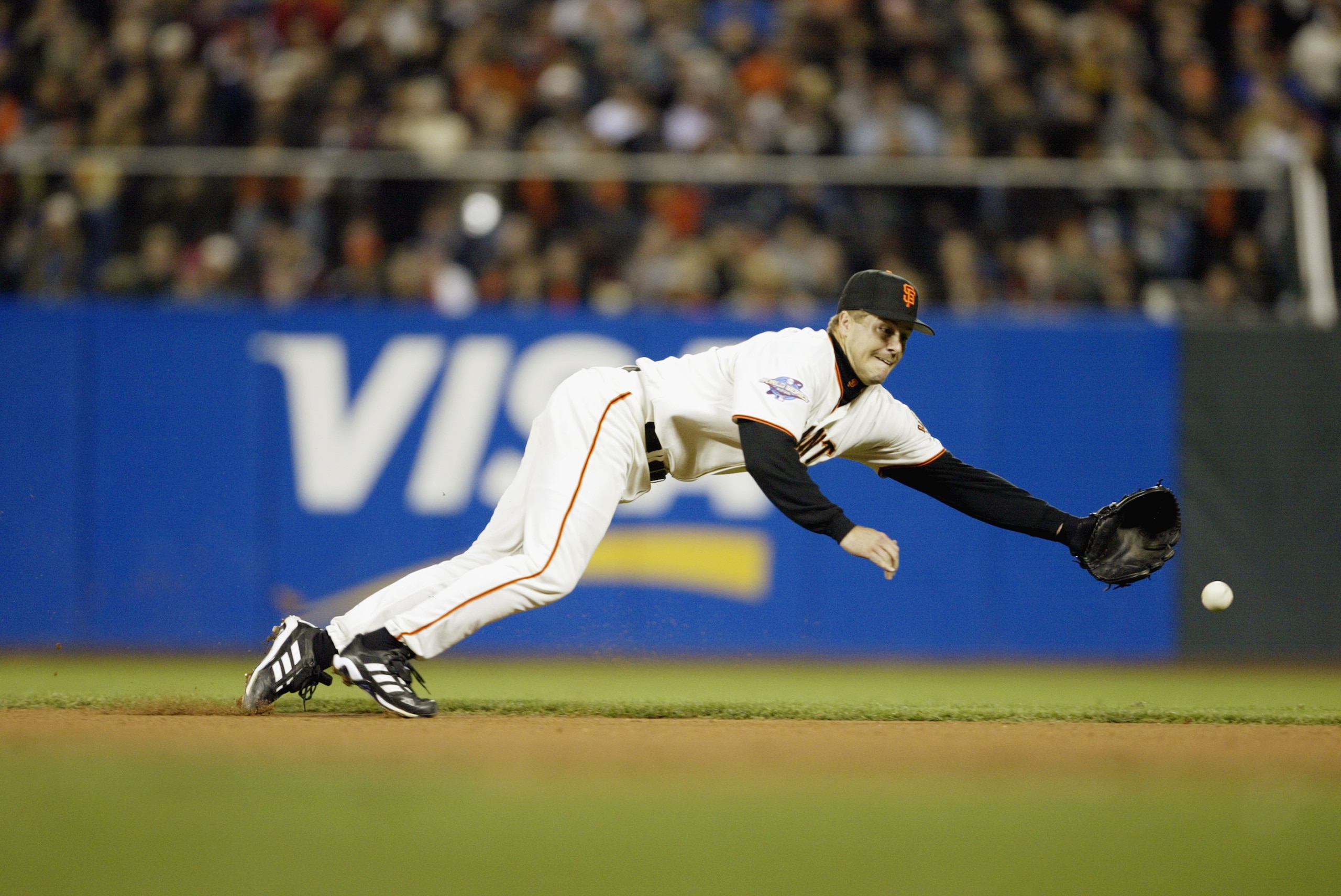 SAN FRANCISCO - OCTOBER 22:  Second baseman Jeff Kent #21 of the San Francisco Giants misses the ball on an RBI single from Scott Spiezio #23 of the Anaheim Angels in the fourth inning during game three of the World Series on at Pacific Bell Park on Octob