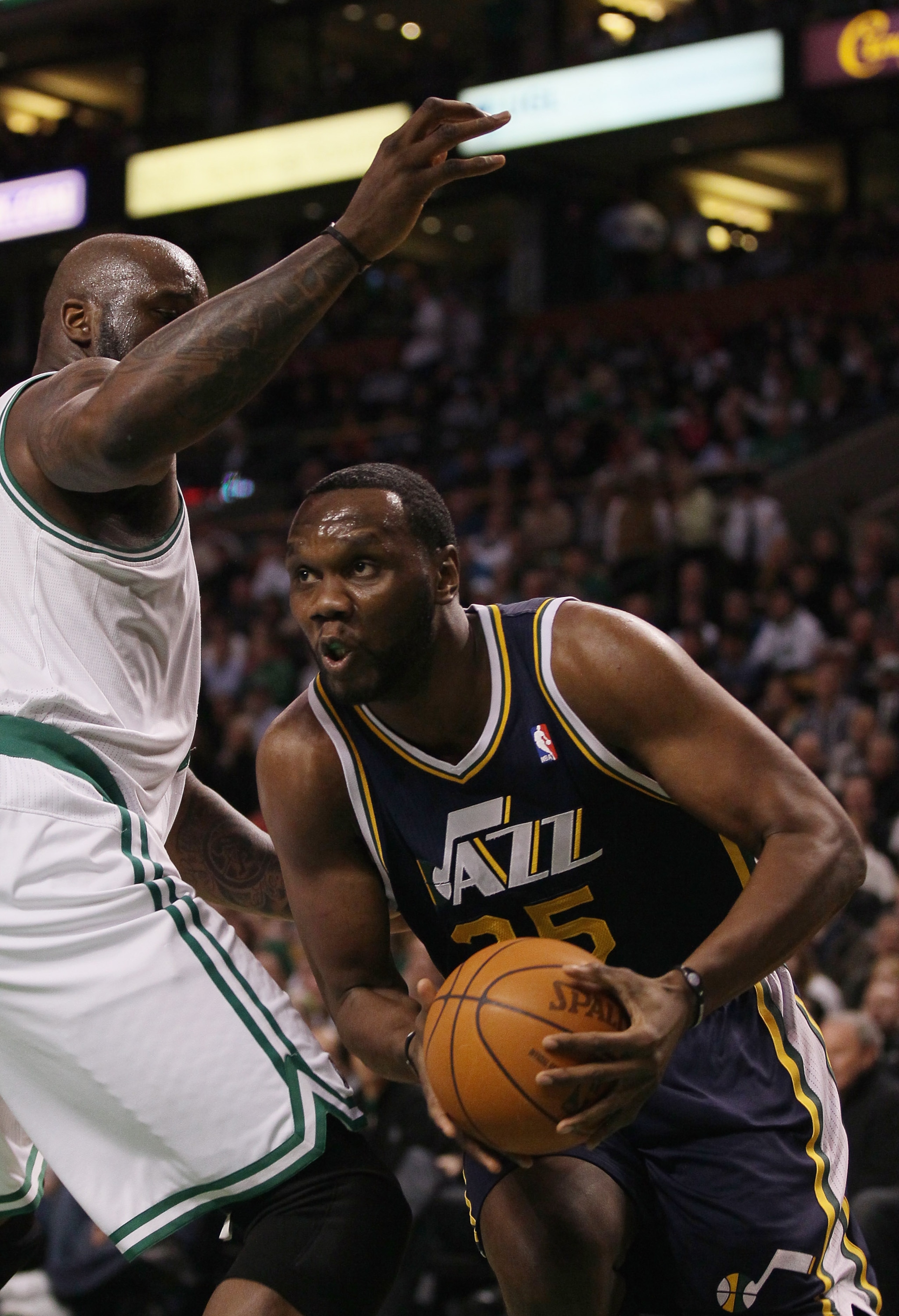 BOSTON, MA - JANUARY 21:  Al Jefferson #25 of the Utah Jazz tries to get around Shaquille O'Neal #36 of the Boston Celtics on January 21, 2011 at the TD Garden in Boston, Massachusetts.  NOTE TO USER: User expressly acknowledges and agrees that, by downlo