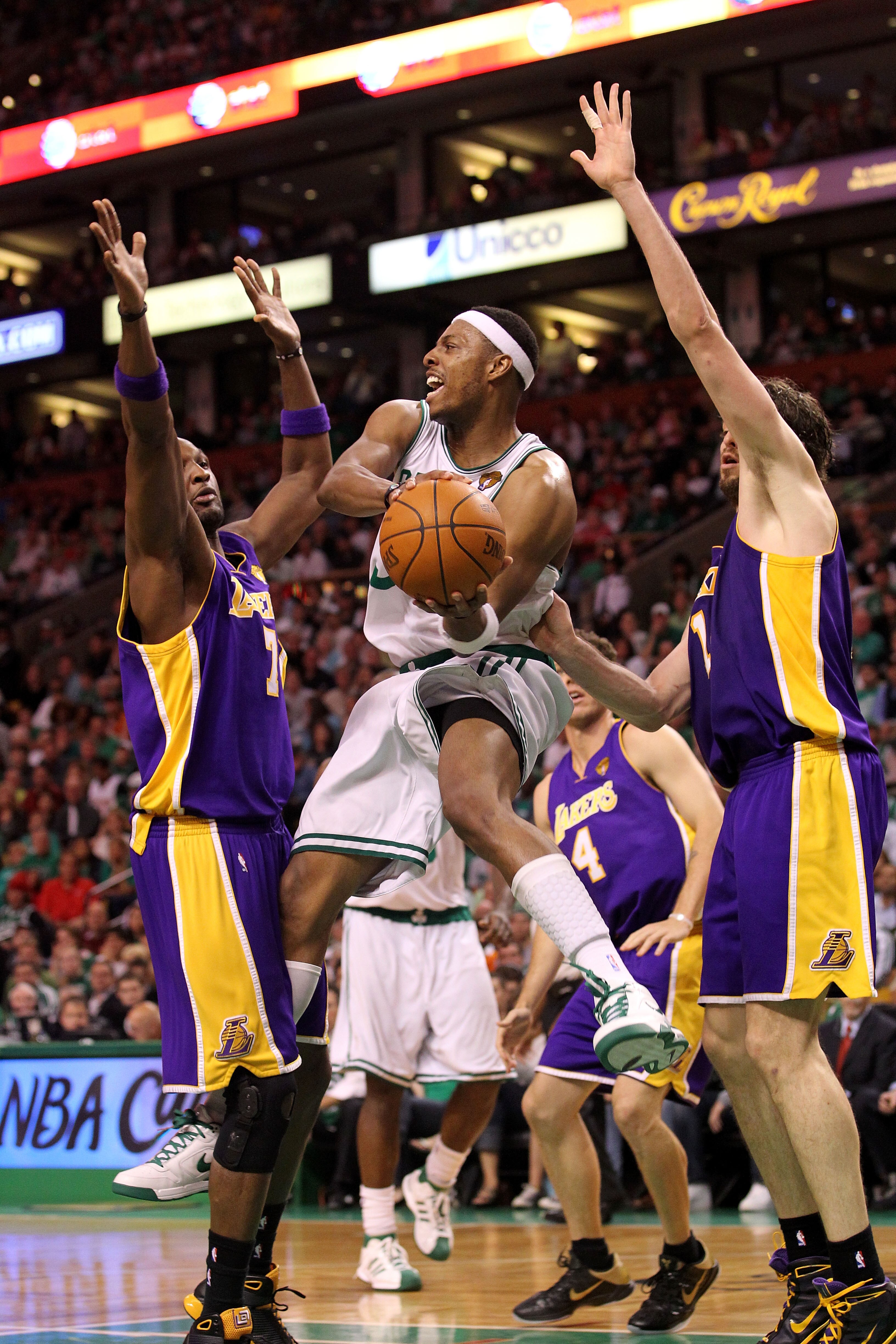 BOSTON - JUNE 13:  Paul Pierce #34 of the Boston Celtics looks to pass against Lamar Odom #7 and Pau Gasol #16 of the Los Angeles Lakers during Game Five of the 2010 NBA Finals on June 13, 2010 at TD Garden in Boston, Massachusetts. NOTE TO USER: User exp