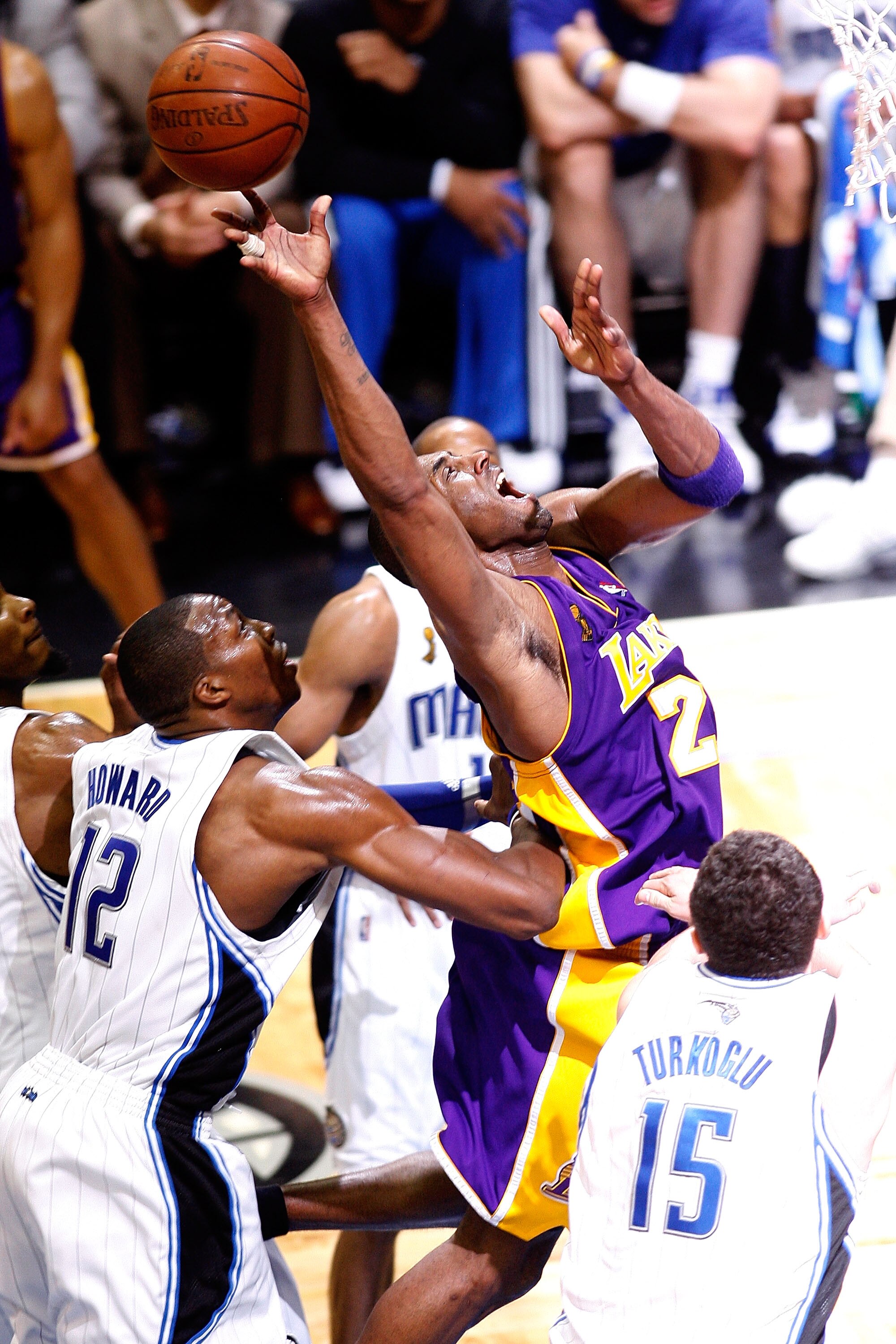 ORLANDO, FL - JUNE 14:  Kobe Bryant #24 of the Los Angeles Lakers goes up for a shot in front of Dwight Howard #12 of the Orlando Magic in the fourth quarter of Game Five of the 2009 NBA Finals on June 14, 2009 at Amway Arena in Orlando, Florida.  NOTE TO