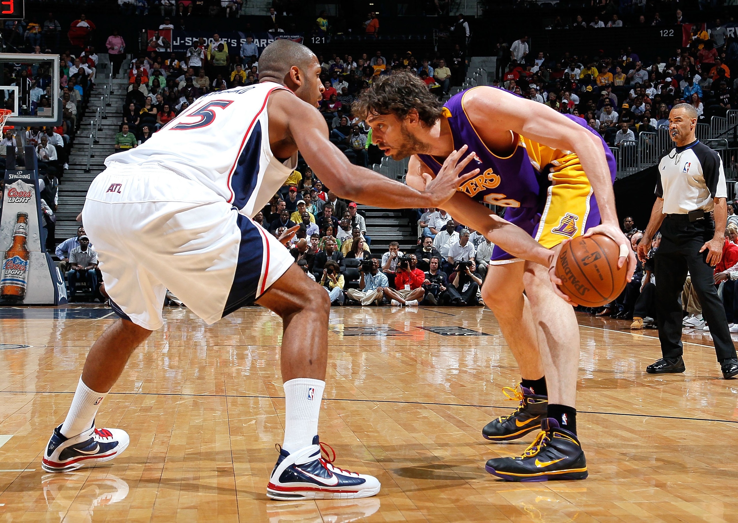 ATLANTA - MARCH 31:  Pau Gasol #16 of the Los Angeles Lakers against Al Horford #15 of the Atlanta Hawks at Philips Arena on March 31, 2010 in Atlanta, Georgia.  NOTE TO USER: User expressly acknowledges and agrees that, by downloading and/or using this P
