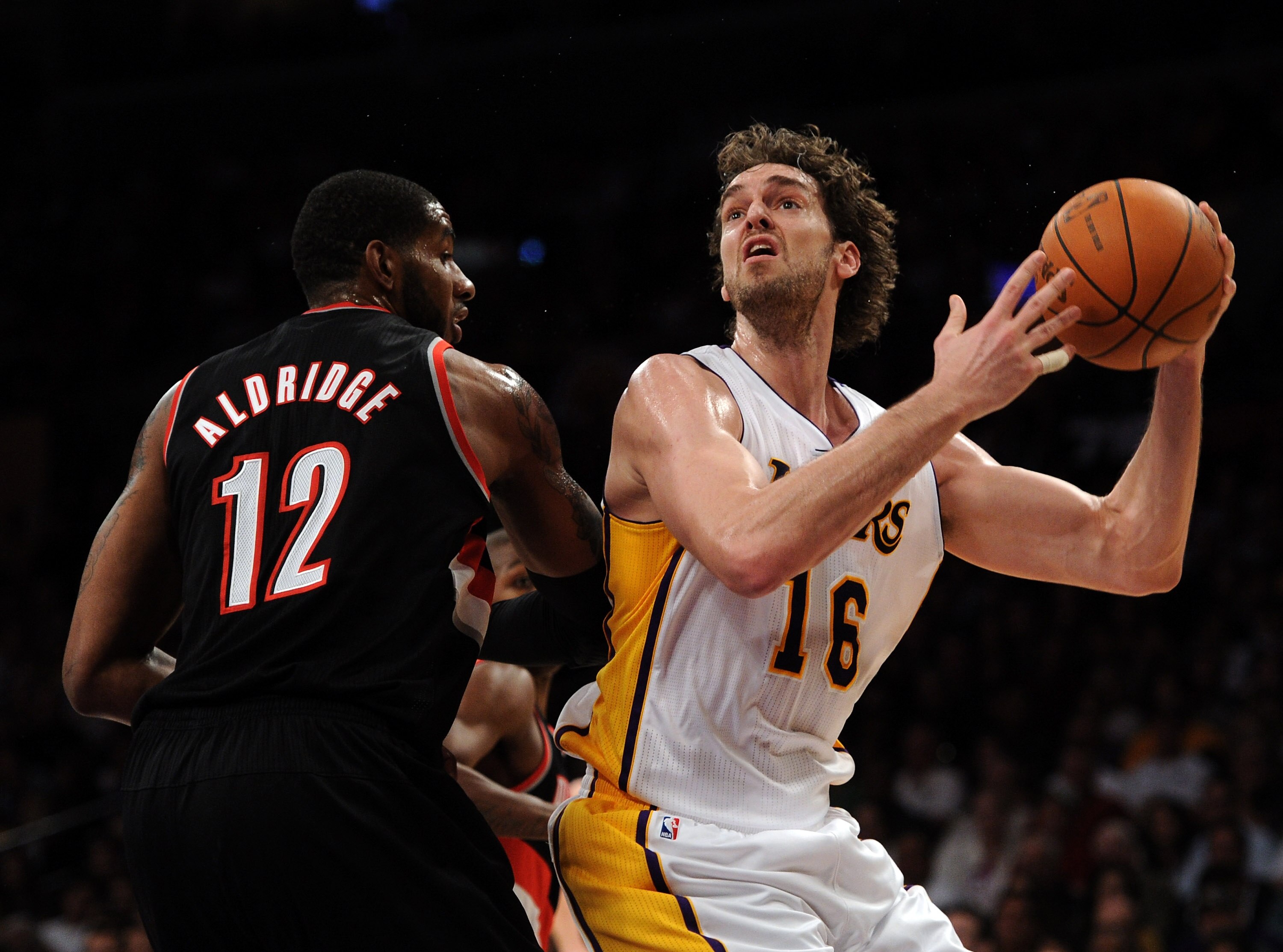 LOS ANGELES, CA - NOVEMBER 07:  Pau Gasol #16 of the Los Angeles Lakers prepares to shoot over LaMarcus Aldridge #12 of the Portland Trail Blazers during the first half at the Staples Center on November 7, 2010 in Los Angeles, California.  NOTE TO USER: U