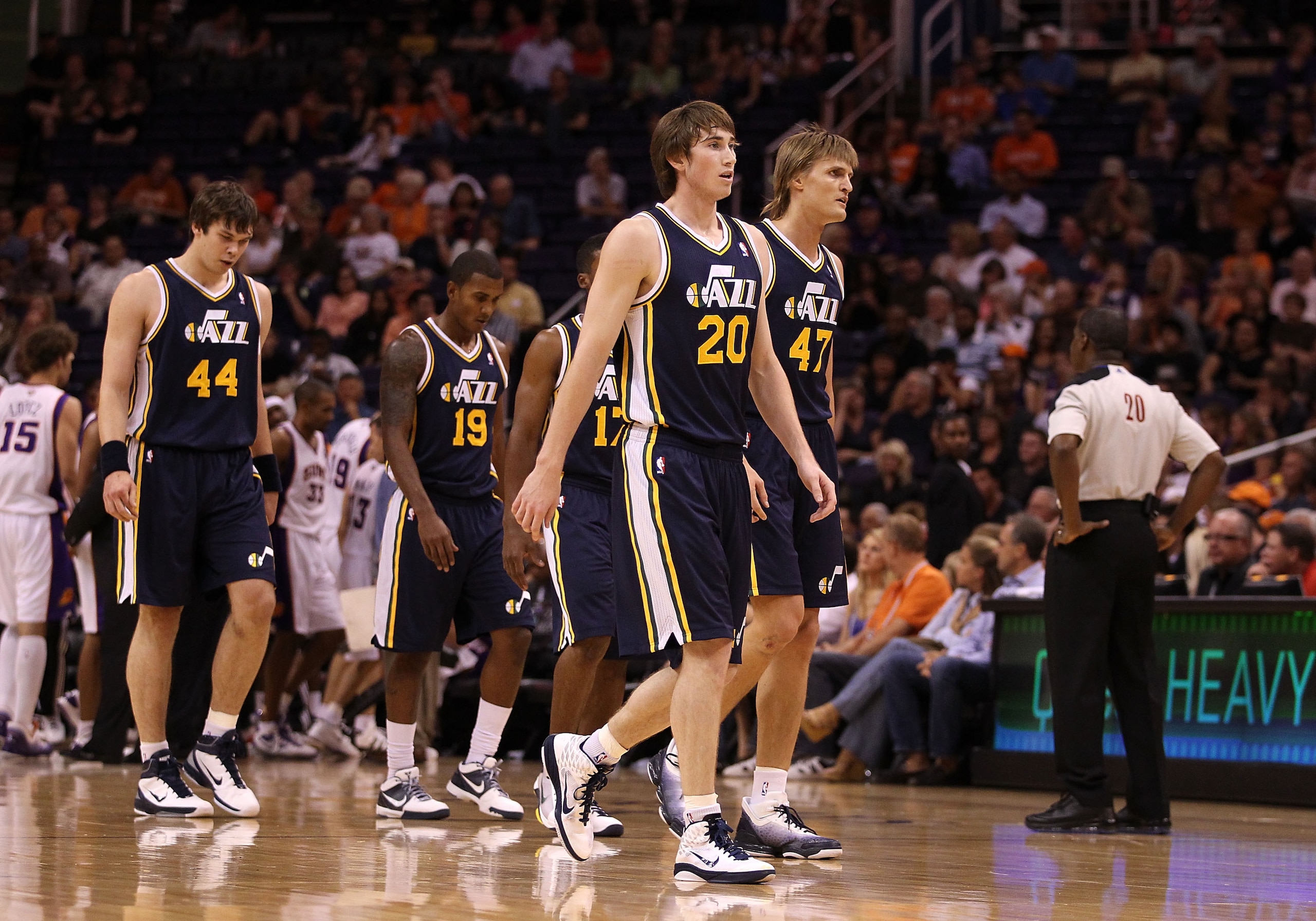 PHOENIX - OCTOBER 12: Gordon Hayward #20 of the Utah Jazz walks back to the bench with teammates during the preseason NBA game against the Phoenix Suns at US Airways Center on October 12, 2010 in Phoenix, Arizona. NOTE TO USER: User expressly acknowledge PHOENIX - OCTOBER 12: Gordon Hayward #20 of the Utah Jazz walks back to the bench with teammates during the preseason NBA game against the Phoenix Suns at US Airways Center on October 12, 2010 in Phoenix, Arizona. NOTE TO USER: User expressly acknowledge