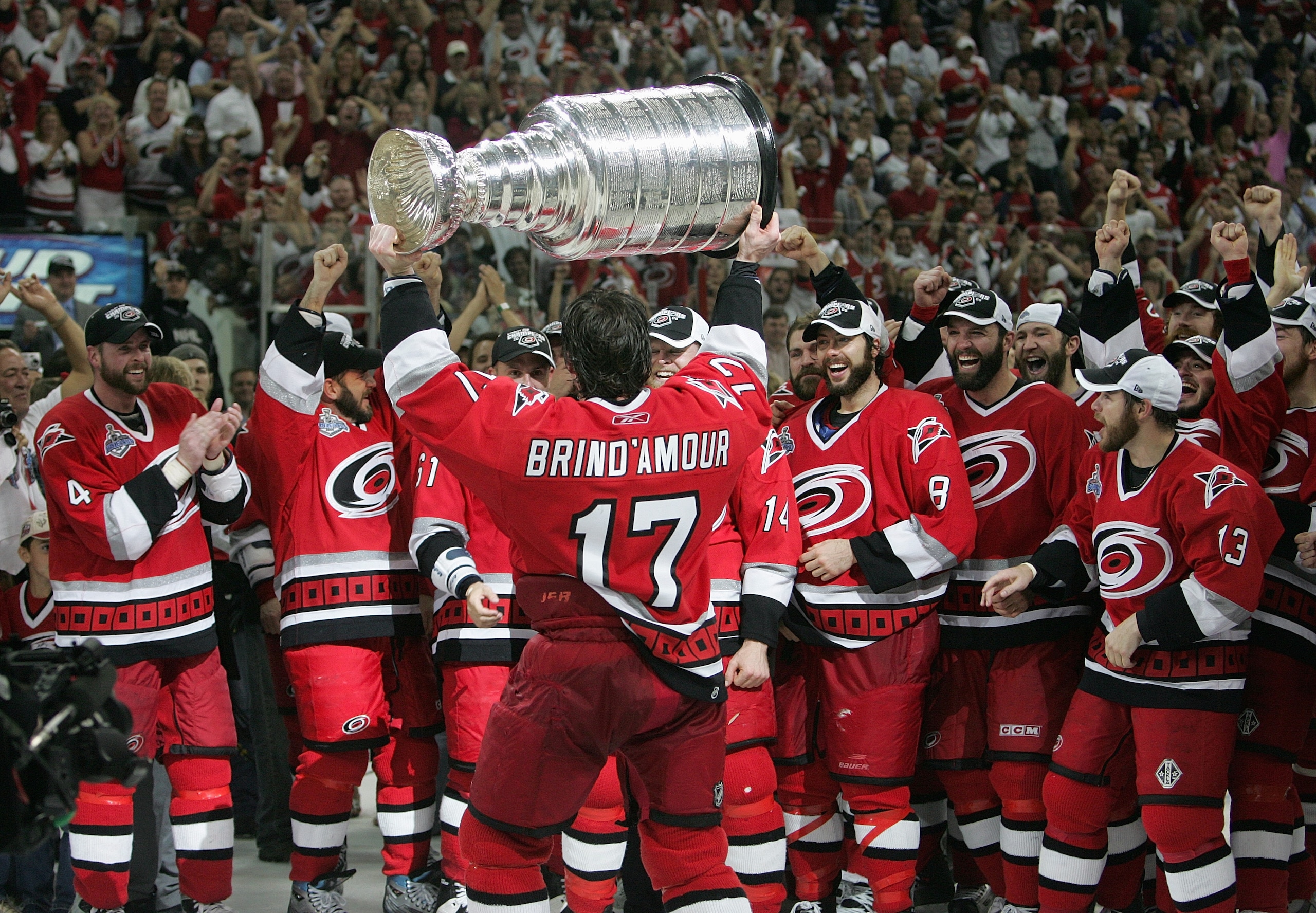 RALEIGH, NC - JUNE 19: Rod Brind'Amour #17 of the Carolina Hurricanes hoists the Stanley Cup in front of his teammates after the Hurricanes defeated the Edmonton Oilers in game seven of the 2006 NHL Stanley Cup Finals on June 19, 2006 at the RBC Center i RALEIGH, NC - JUNE 19: Rod Brind'Amour #17 of the Carolina Hurricanes hoists the Stanley Cup in front of his teammates after the Hurricanes defeated the Edmonton Oilers in game seven of the 2006 NHL Stanley Cup Finals on June 19, 2006 at the RBC Center i