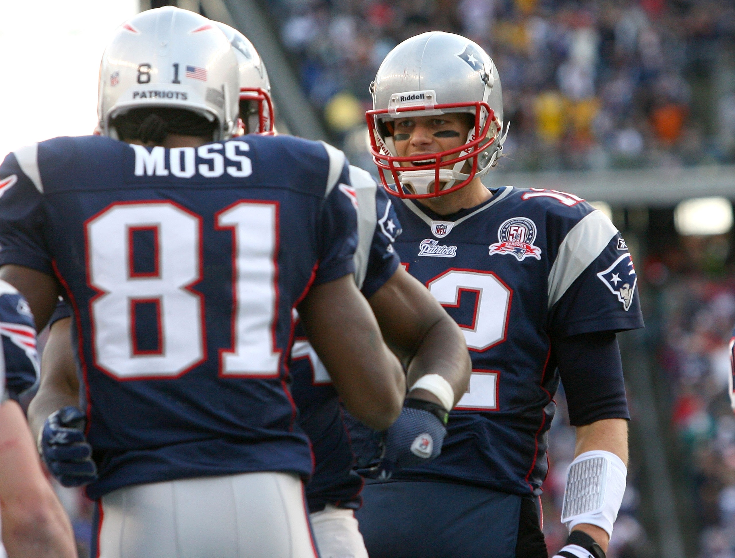 FOXBORO, MA - DECEMBER 27: Randy Moss #81 of the New England Patriots is congratulated by team mate Tom Brady #12 after catching his third touchdown pass of the day against the Jacksonville Jaguars in the fourth quarter at Gillette Stadium on December 27,