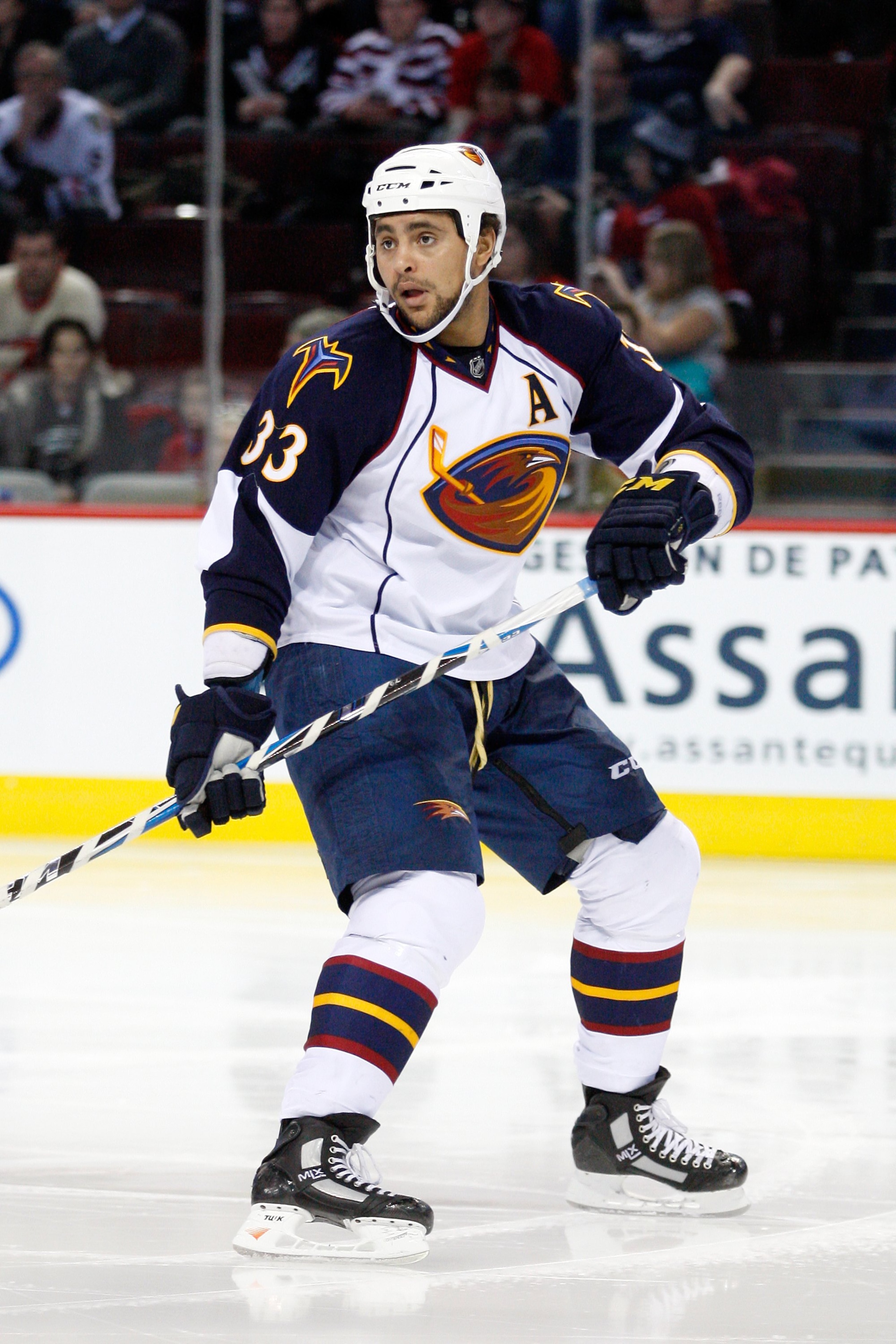 MONTREAL, CANADA - JANUARY 2: Dustin Byfuglien #33 of the Atlanta Thrashers skates during the NHL game against the Montreal Canadiens at the Bell Centre on January 2, 2011 in Montreal, Quebec, Canada. The Thrashers defeated the Canadiens 4-3 in overtime MONTREAL, CANADA - JANUARY 2: Dustin Byfuglien #33 of the Atlanta Thrashers skates during the NHL game against the Montreal Canadiens at the Bell Centre on January 2, 2011 in Montreal, Quebec, Canada. The Thrashers defeated the Canadiens 4-3 in overtime