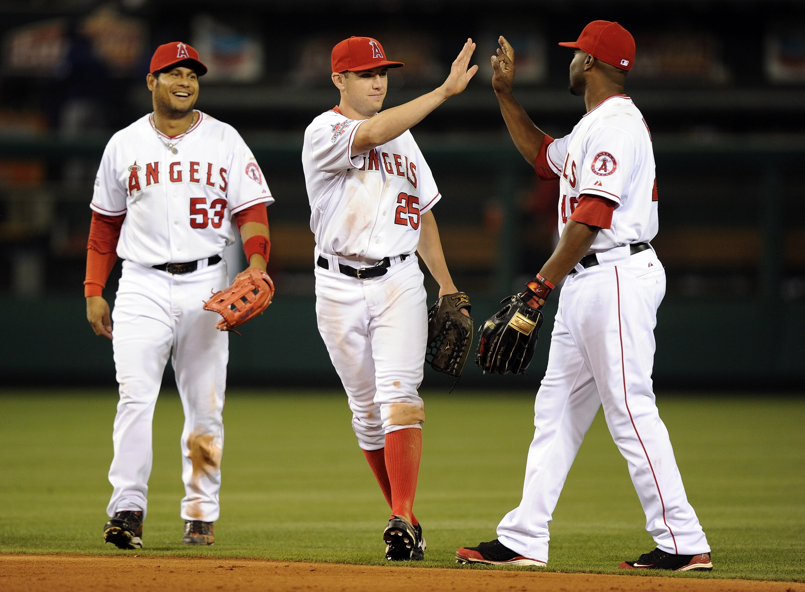ANAHEIM, CA - SEPTEMBER 20: Peter Bourjos #25, Bobby Abreu #53 and Torii Hunter #48 of the Los Angeles Angels of Anaheim celebrate a 7-4 win over the Texas Rangers during the ninth inning at Angel Stadium on September 20, 2010 in Anaheim, California. (P ANAHEIM, CA - SEPTEMBER 20: Peter Bourjos #25, Bobby Abreu #53 and Torii Hunter #48 of the Los Angeles Angels of Anaheim celebrate a 7-4 win over the Texas Rangers during the ninth inning at Angel Stadium on September 20, 2010 in Anaheim, California. (P