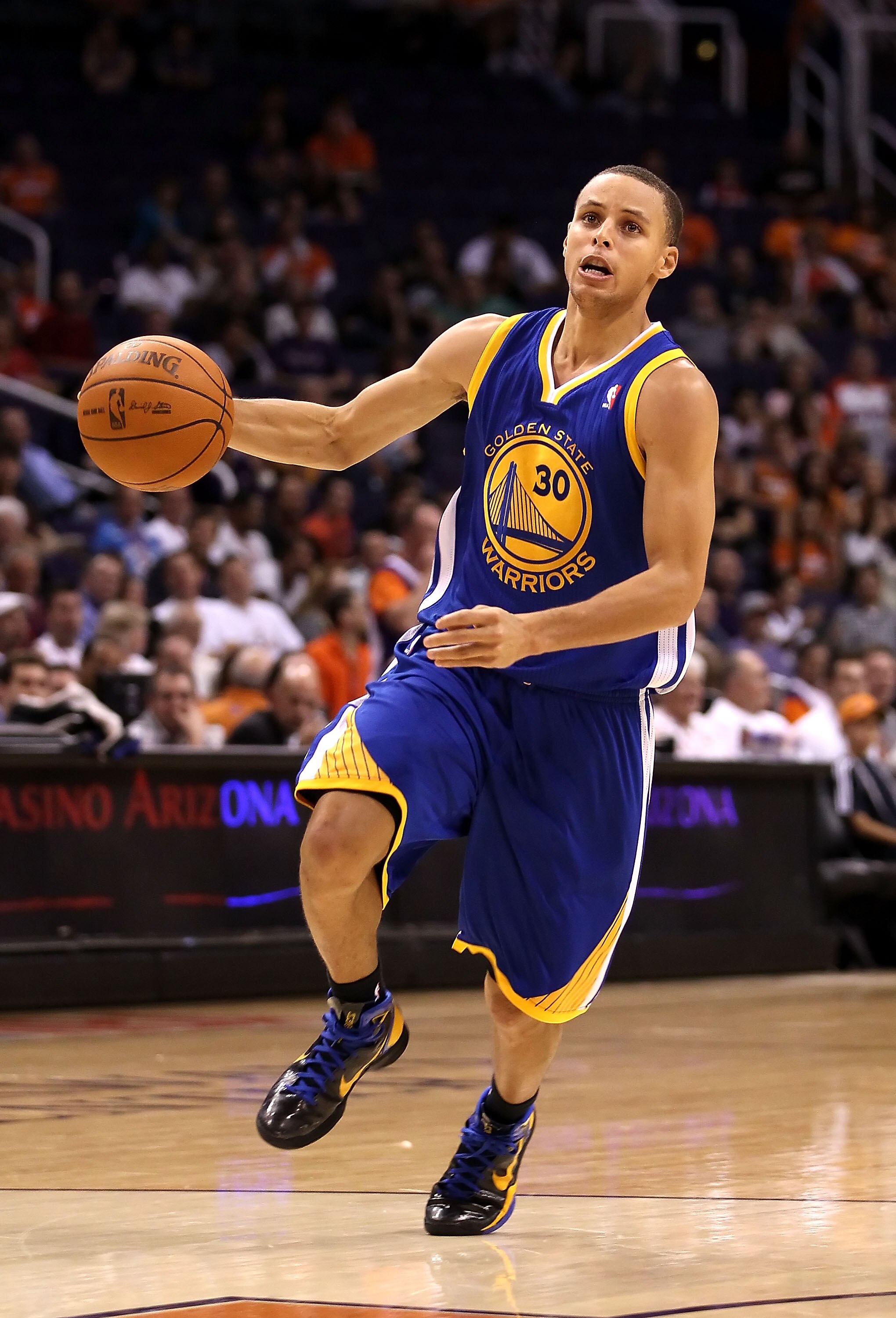 PHOENIX - OCTOBER 19:  Stephen Curry #30 of the Golden State Warriors drives to the basket during the preseason NBA game against the Phoenix Suns at US Airways Center on October 19, 2010 in Phoenix, Arizona. NOTE TO USER: User expressly acknowledges and a