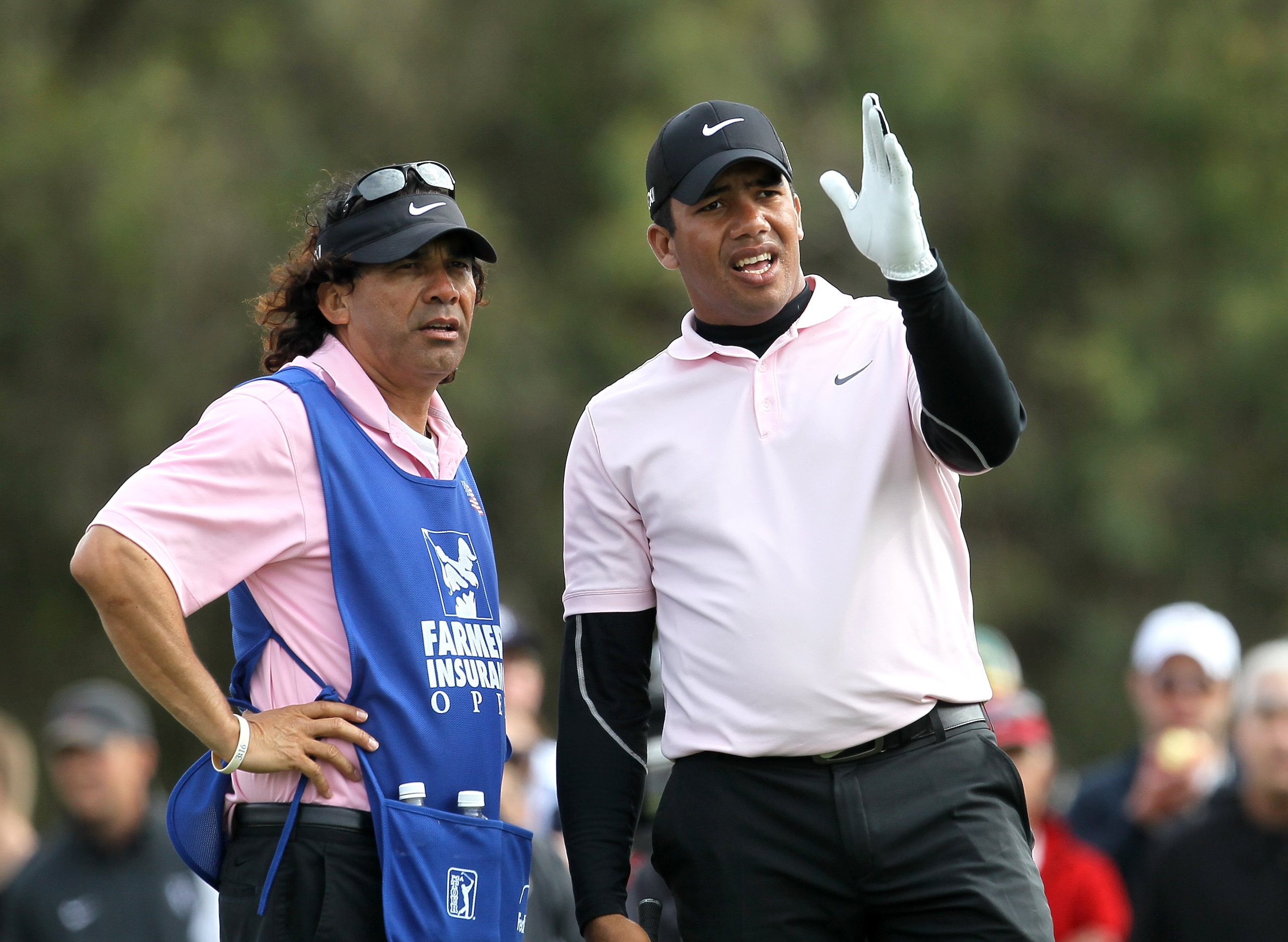LA JOLLA, CA - JANUARY 30:  Jhonattan Vegas of Venzuelaand his caddie talk over his tee shot on the 12th hole during the final round of the Farmers Insurance Open at Torrey Pines South Course on January 30, 2011 in La Jolla, California.  (Photo by Stephen