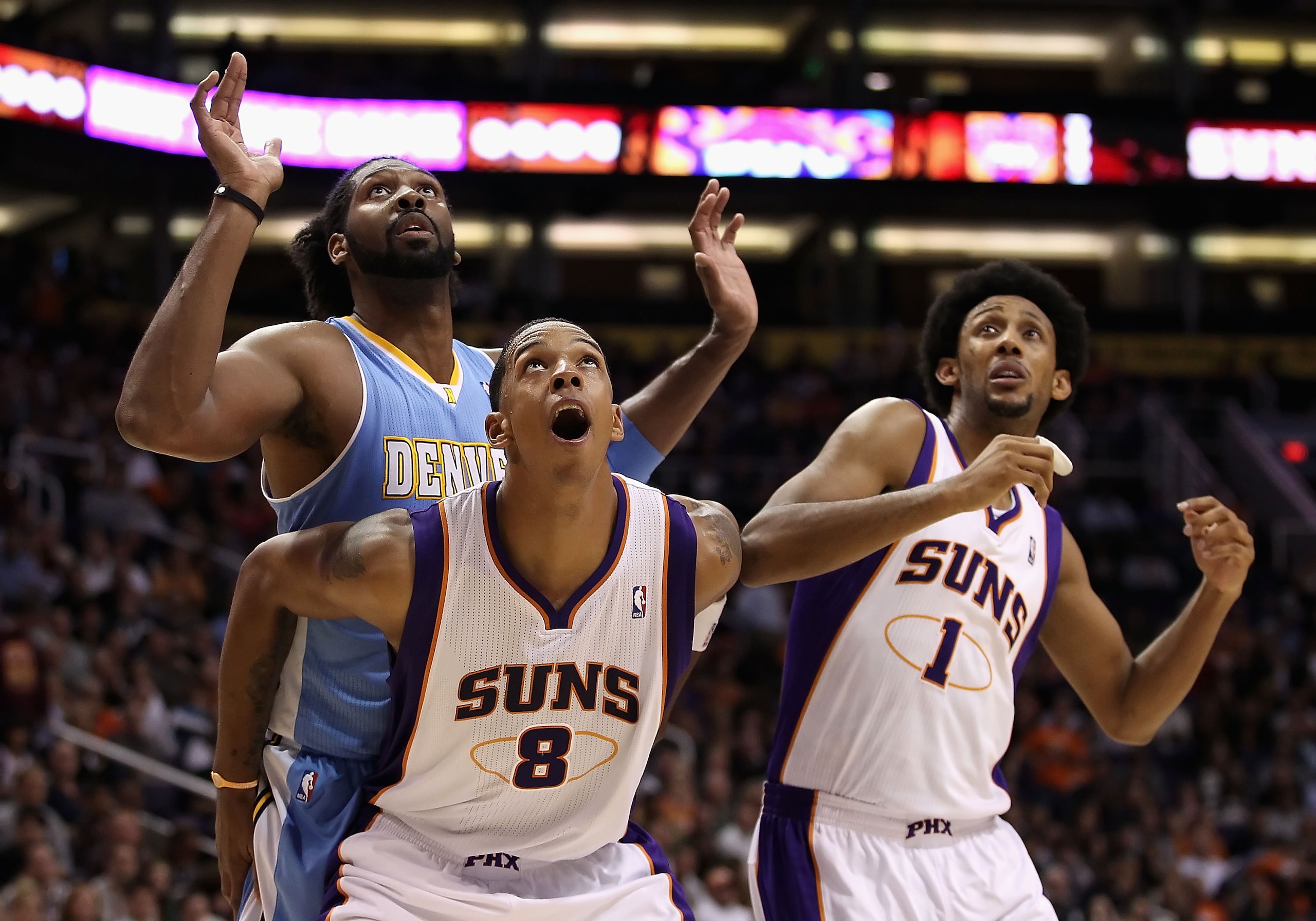 PHOENIX - NOVEMBER 15:  Channing Frye #8 of the Phoenix Suns blocks out Nene #31 of the Denver Nuggets during the NBA game at US Airways Center on November 15, 2010 in Phoenix, Arizona. NOTE TO USER: User expressly acknowledges and agrees that, by downloa