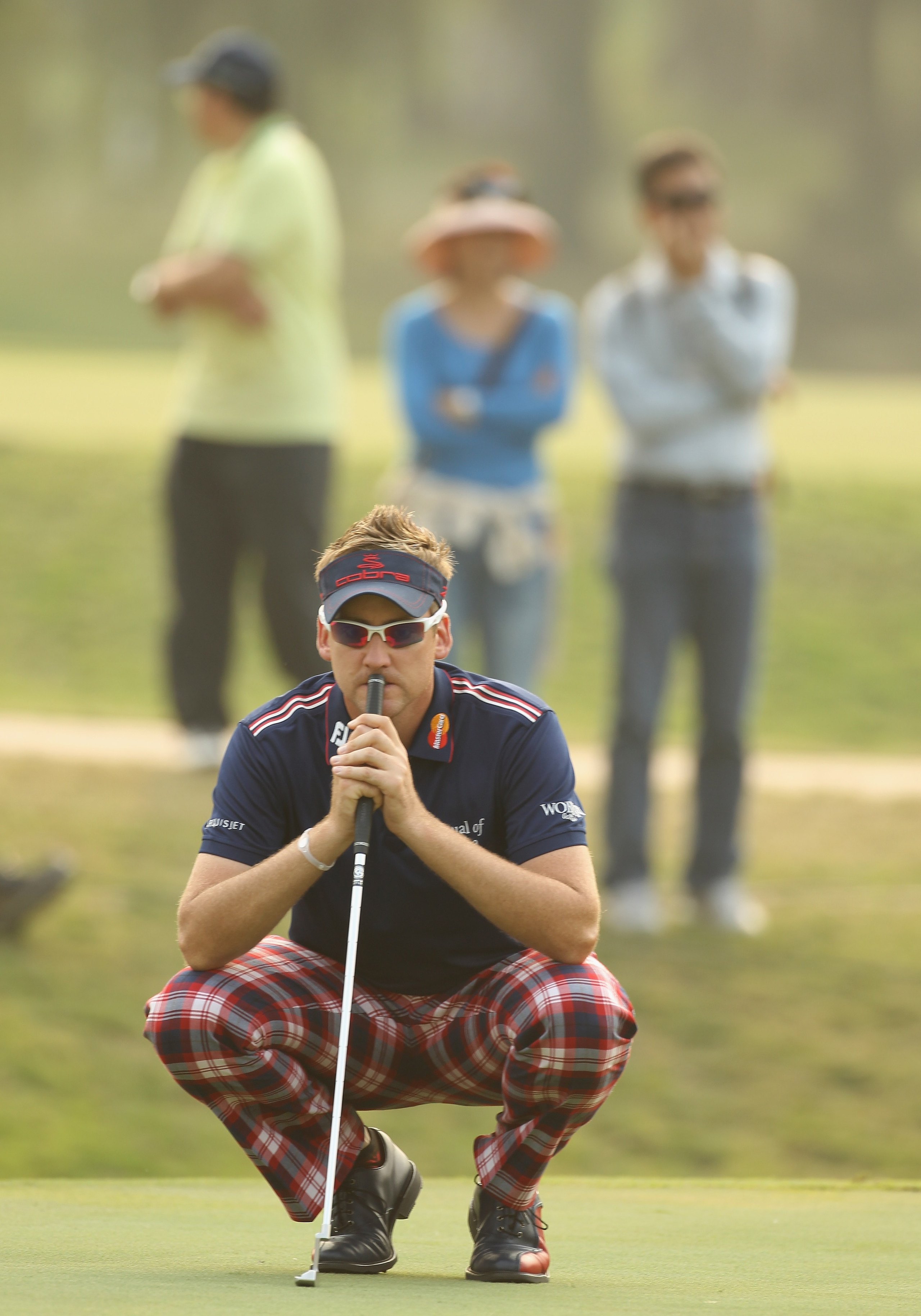 HONG KONG - NOVEMBER 19: Ian Poulter of England lines up a putt on the 18th green during day two of the UBS Hong Kong Open at The Hong Kong Golf Club on November 19, 2010 in Hong Kong, Hong Kong. (Photo by Ian Walton/Getty Images) HONG KONG - NOVEMBER 19: Ian Poulter of England lines up a putt on the 18th green during day two of the UBS Hong Kong Open at The Hong Kong Golf Club on November 19, 2010 in Hong Kong, Hong Kong. (Photo by Ian Walton/Getty Images)