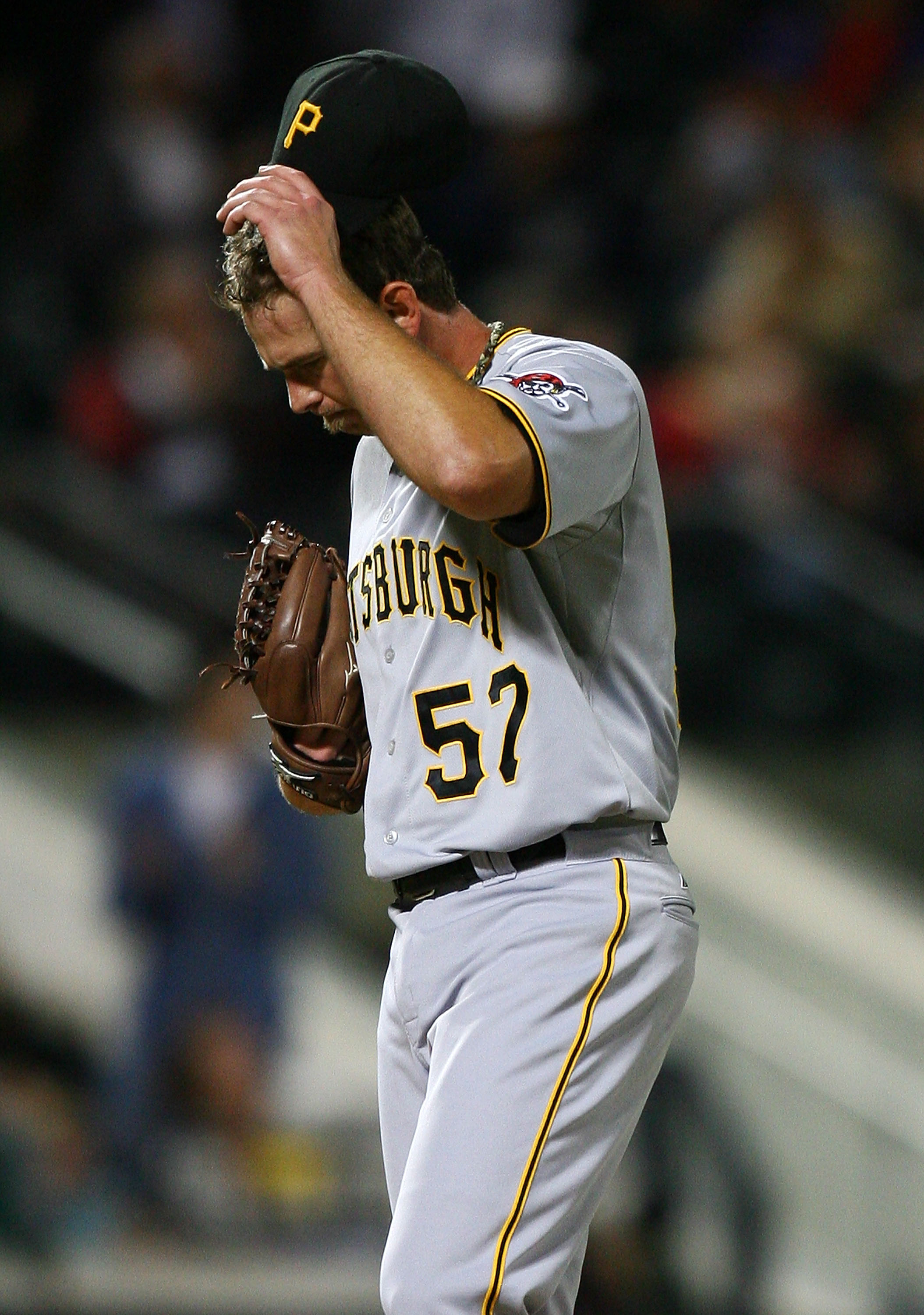 NEW YORK - SEPTEMBER 14: Zach Duke #57 of the Pittsburgh Pirates reacts after allowing a home run against the New York Mets on September 14, 2010 at Citi Field in the Flushing neighborhood of the Queens borough of New York City. (Photo by Andrew Burton/