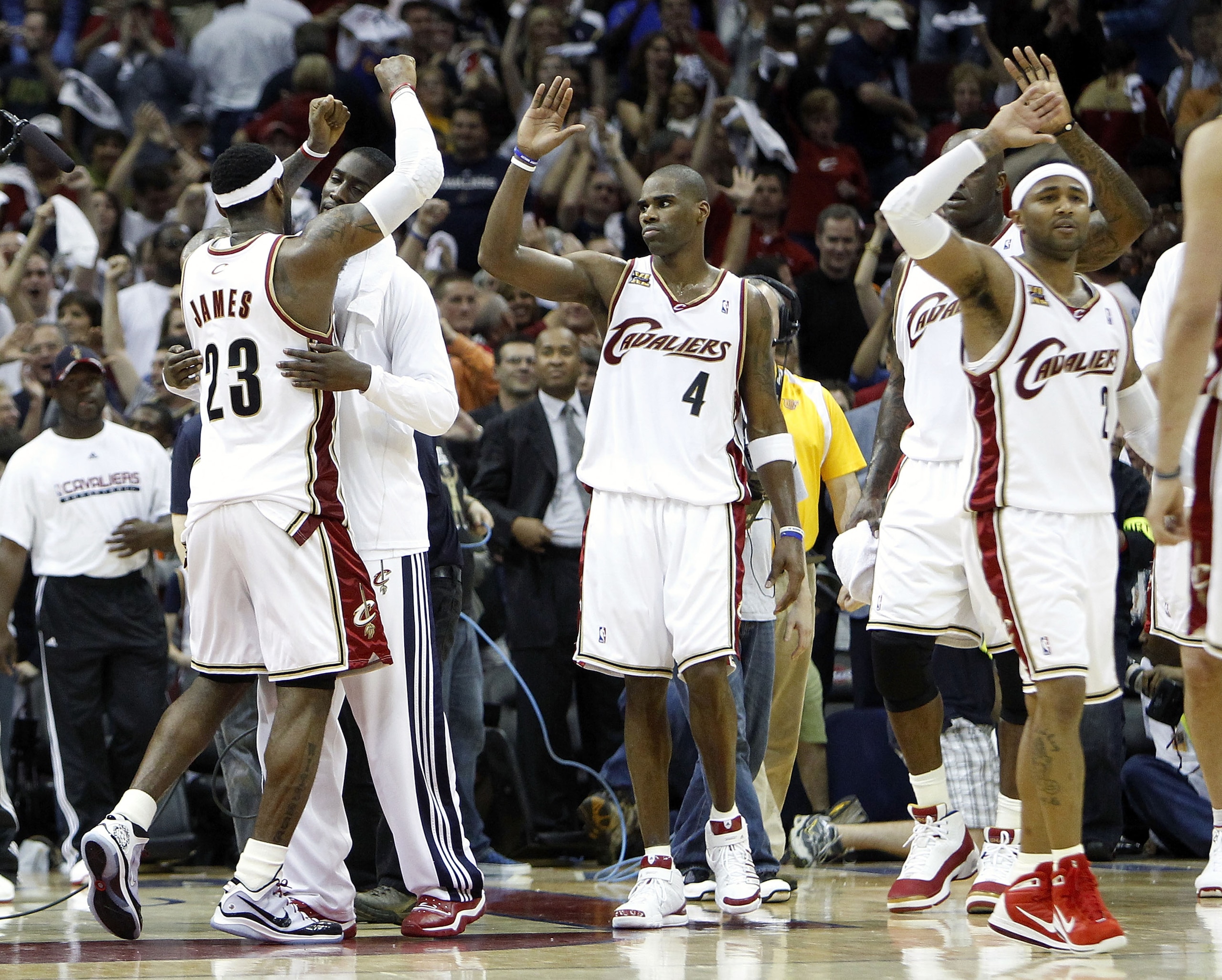 CLEVELAND - MAY 01: LeBron James #23 of the Cleveland Cavaliers celebrates with J.J. Hickson #21 and Antawn Jamison #4 after beating the Boston Celtics 101-93 in Game One of the Eastern Conference Semifinals during the 2010 NBA Playoffs at Quicken Loans CLEVELAND - MAY 01: LeBron James #23 of the Cleveland Cavaliers celebrates with J.J. Hickson #21 and Antawn Jamison #4 after beating the Boston Celtics 101-93 in Game One of the Eastern Conference Semifinals during the 2010 NBA Playoffs at Quicken Loans
