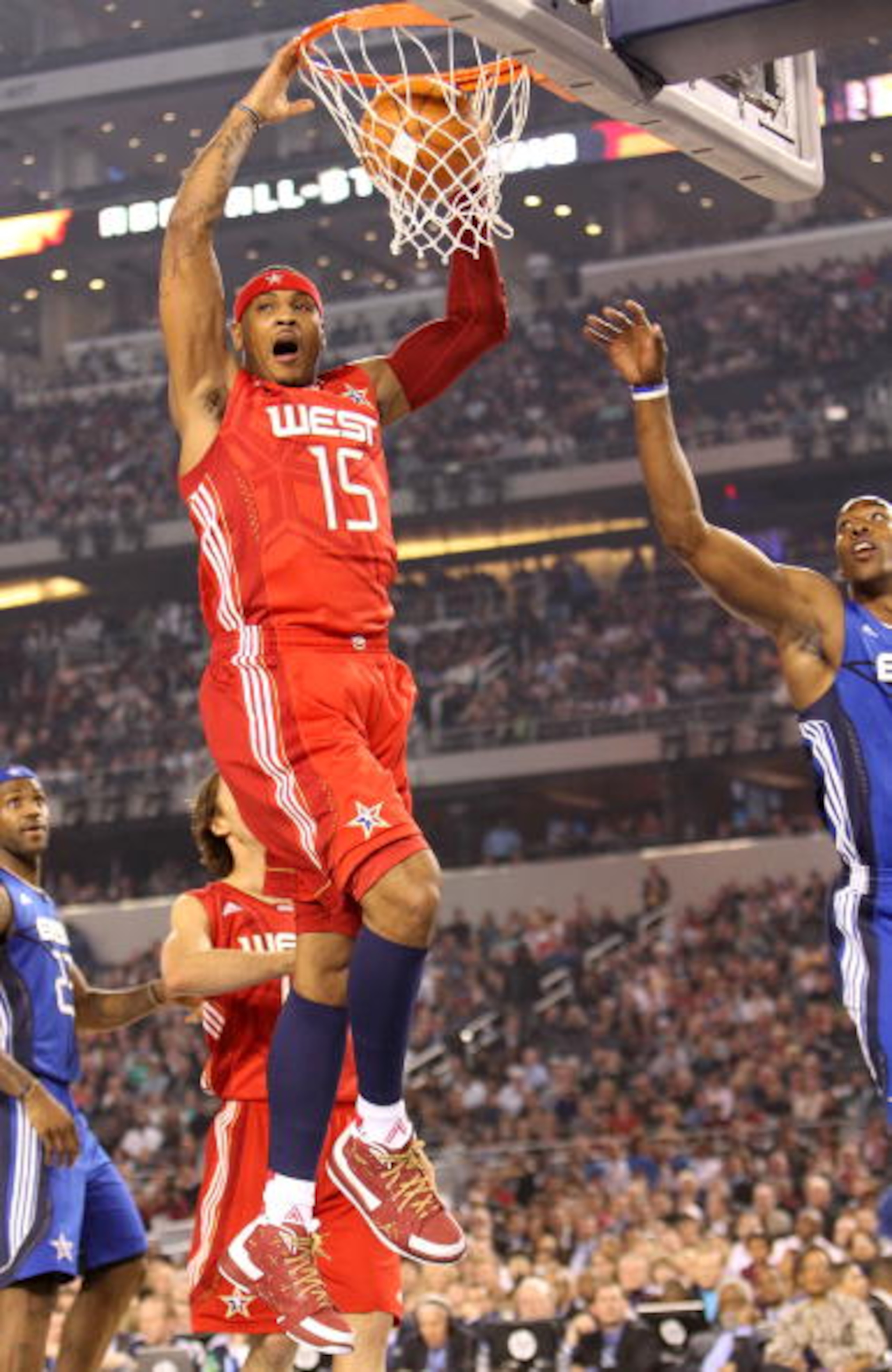 ARLINGTON, TX - FEBRUARY 14: Carmelo Anthony #15 of the Western Conference shoots against LeBron James #23 and Dwight Howard #12 of the Eastern Conference during the first quarter of the NBA All-Star Game, part of 2010 NBA All-Star Weekend at Cowboys Sta ARLINGTON, TX - FEBRUARY 14: Carmelo Anthony #15 of the Western Conference shoots against LeBron James #23 and Dwight Howard #12 of the Eastern Conference during the first quarter of the NBA All-Star Game, part of 2010 NBA All-Star Weekend at Cowboys Sta