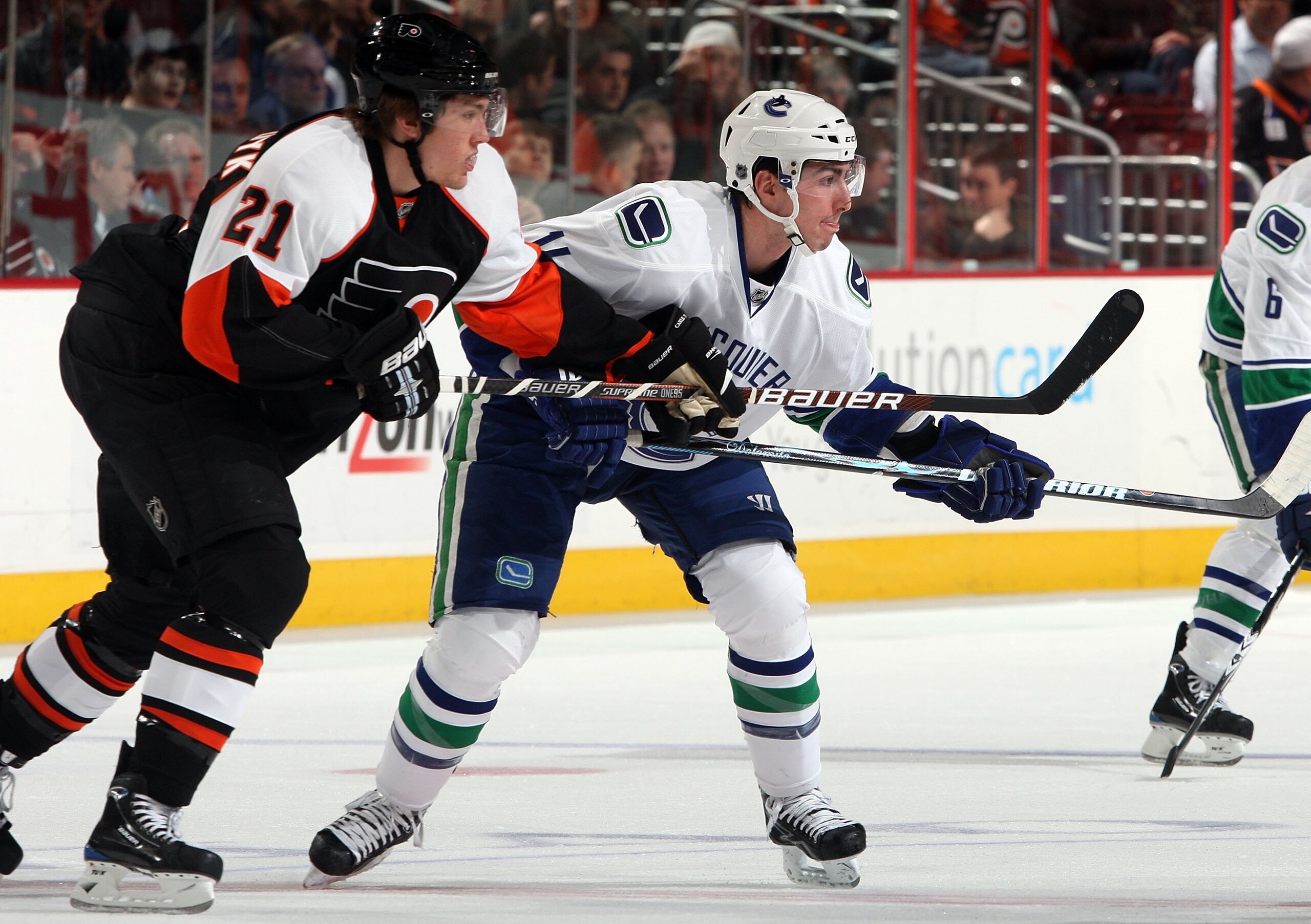 PHILADELPHIA - DECEMBER 03:  Alexandre Burrows #14 of the Vancouver Canucks skates against James van Riemsdyk #21 of the Philadelphia Flyers on December 3, 2009 at Wachovia Center in Philadelphia, Pennsylvania. The Canucks defeated the Flyers 3-0.  (Photo