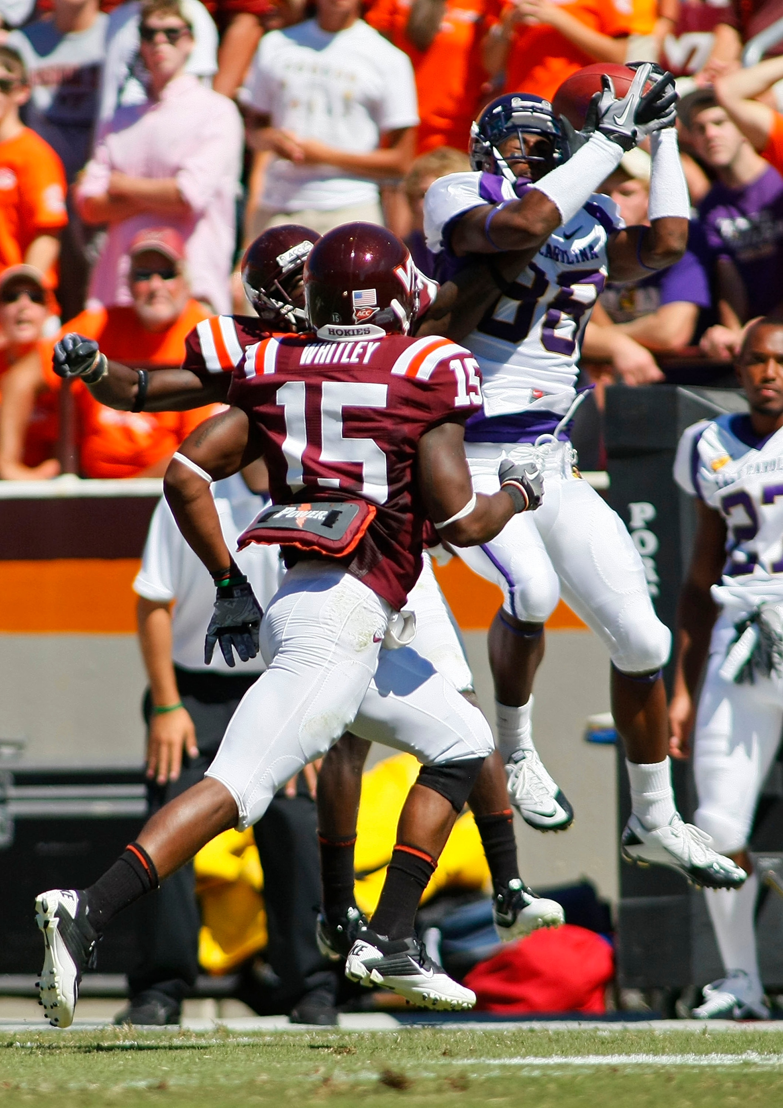 BLACKSBURG, VA - SEPTEMBER 18: Wide receiver Lance Lewis #88 of the East Carolina Pirates tries to make a catch as cornerback Rashad Carmichael #21 and safety Eddie Whitley #15 of the Virginia Tech Hokies defend at Lane Stadium on September 18, 2010 in Bl BLACKSBURG, VA - SEPTEMBER 18: Wide receiver Lance Lewis #88 of the East Carolina Pirates tries to make a catch as cornerback Rashad Carmichael #21 and safety Eddie Whitley #15 of the Virginia Tech Hokies defend at Lane Stadium on September 18, 2010 in Bl
