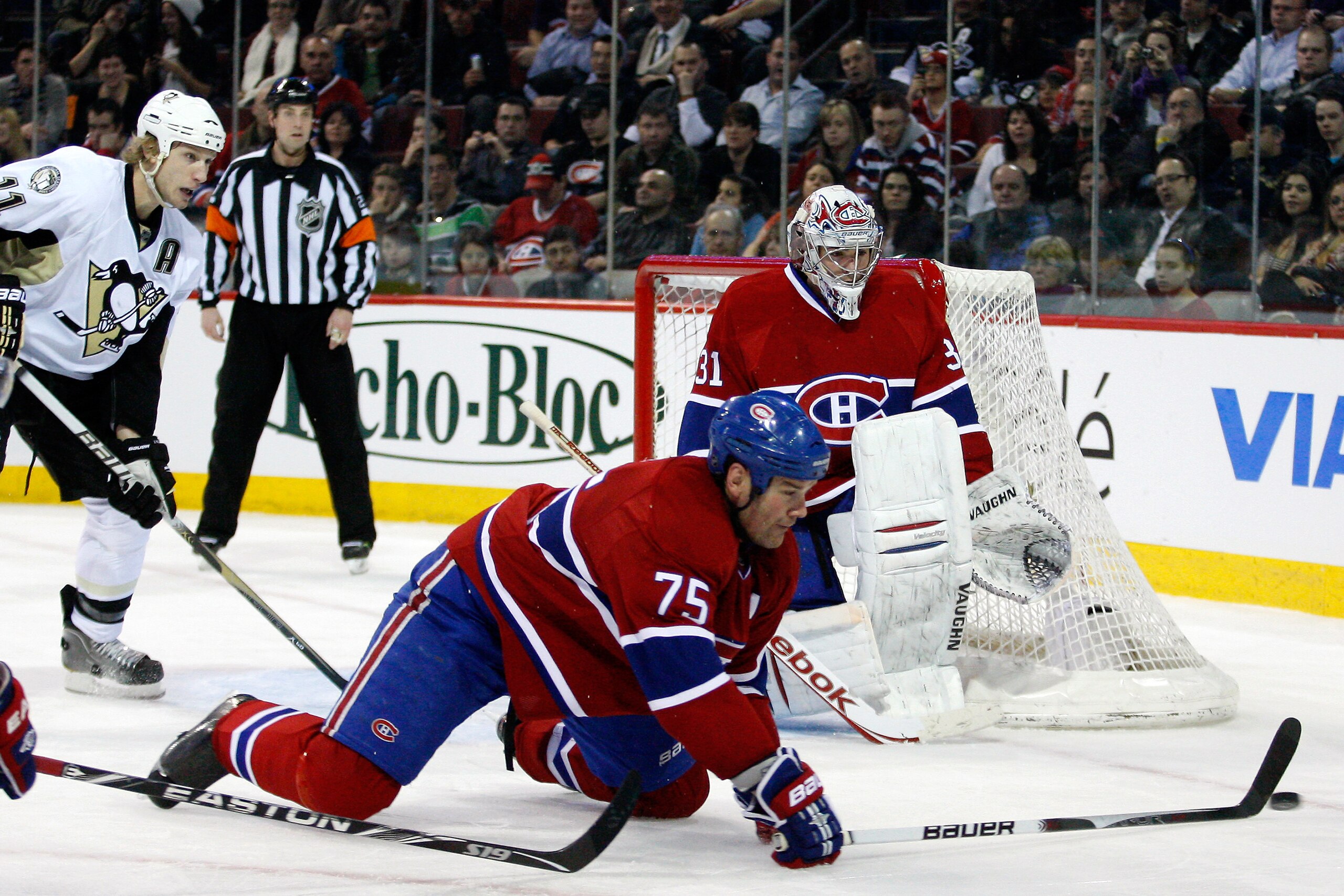 MONTREAL, CANADA - JANUARY 12:  Hal Gill #75 gets down to block a shot in front of Carey Price #31 of the Montreal Canadiens during the NHL game against the Pittsburgh Penguins at the Bell Centre on January 12, 2011 in Montreal, Quebec, Canada.  The Pengu