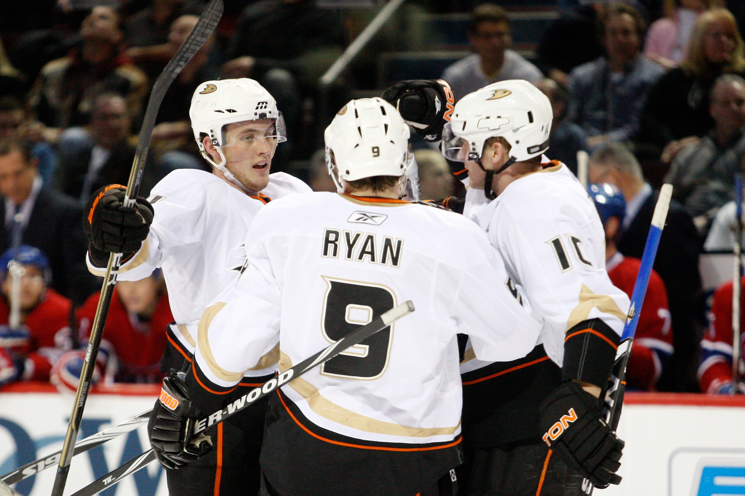 MONTREAL, CANADA - JANUARY 22:  Cam Fowler #4 of the Anaheim Ducks celebrates his first period goal with teammates Bobby Ryan #9 and Corey Perry #10 during the NHL game against the Montreal Canadiens at the Bell Centre on January 22, 2011 in Montreal, Que