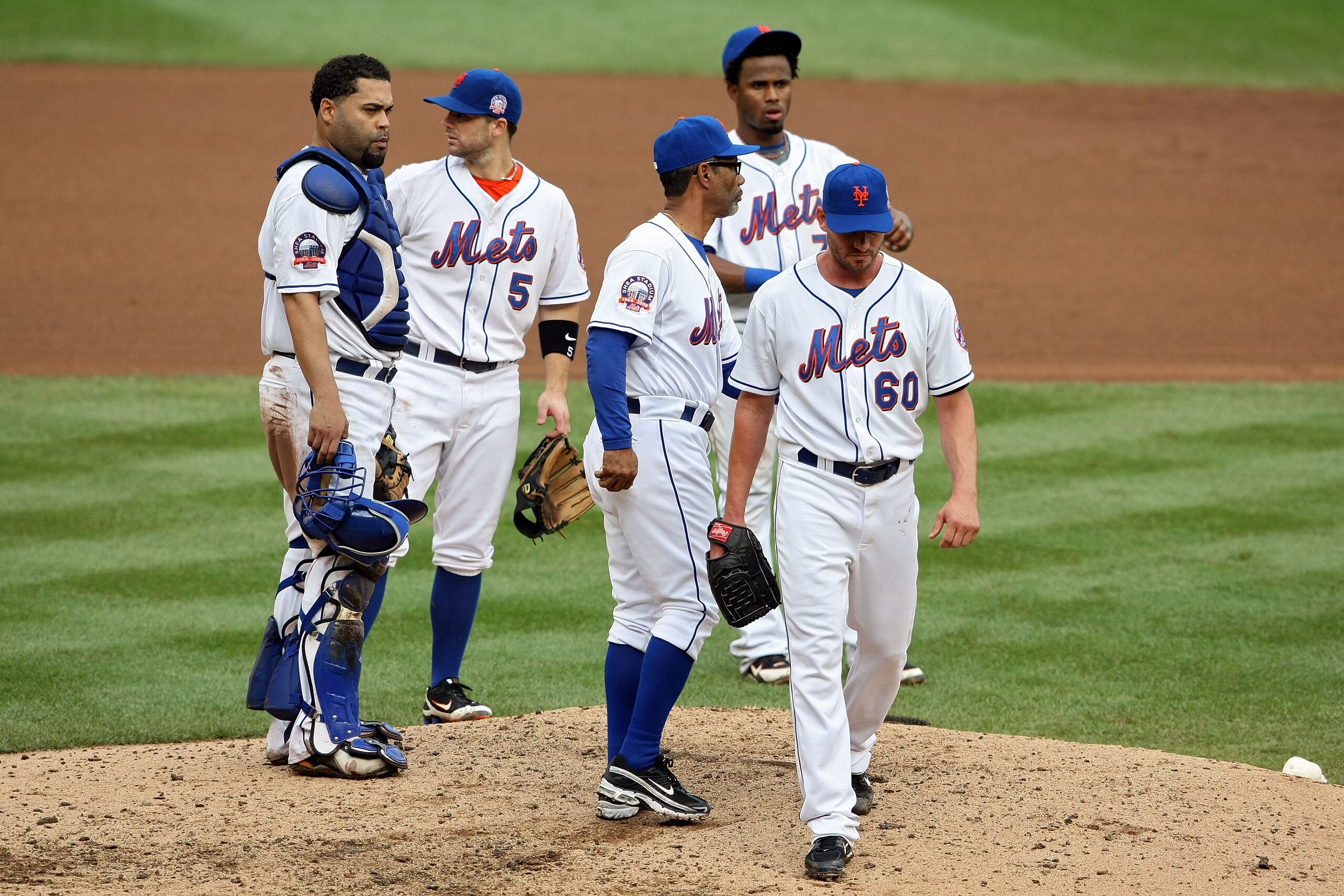 NEW YORK - SEPTEMBER 28:  Pitcher Scott Schoeneweis #60 of the New York Mets is taken out of the game by manager Jerrry Manuel as Ramon Castro, David Wright and Jose Reyes look on against  the Florida Marlins during the last regular season baseball game e