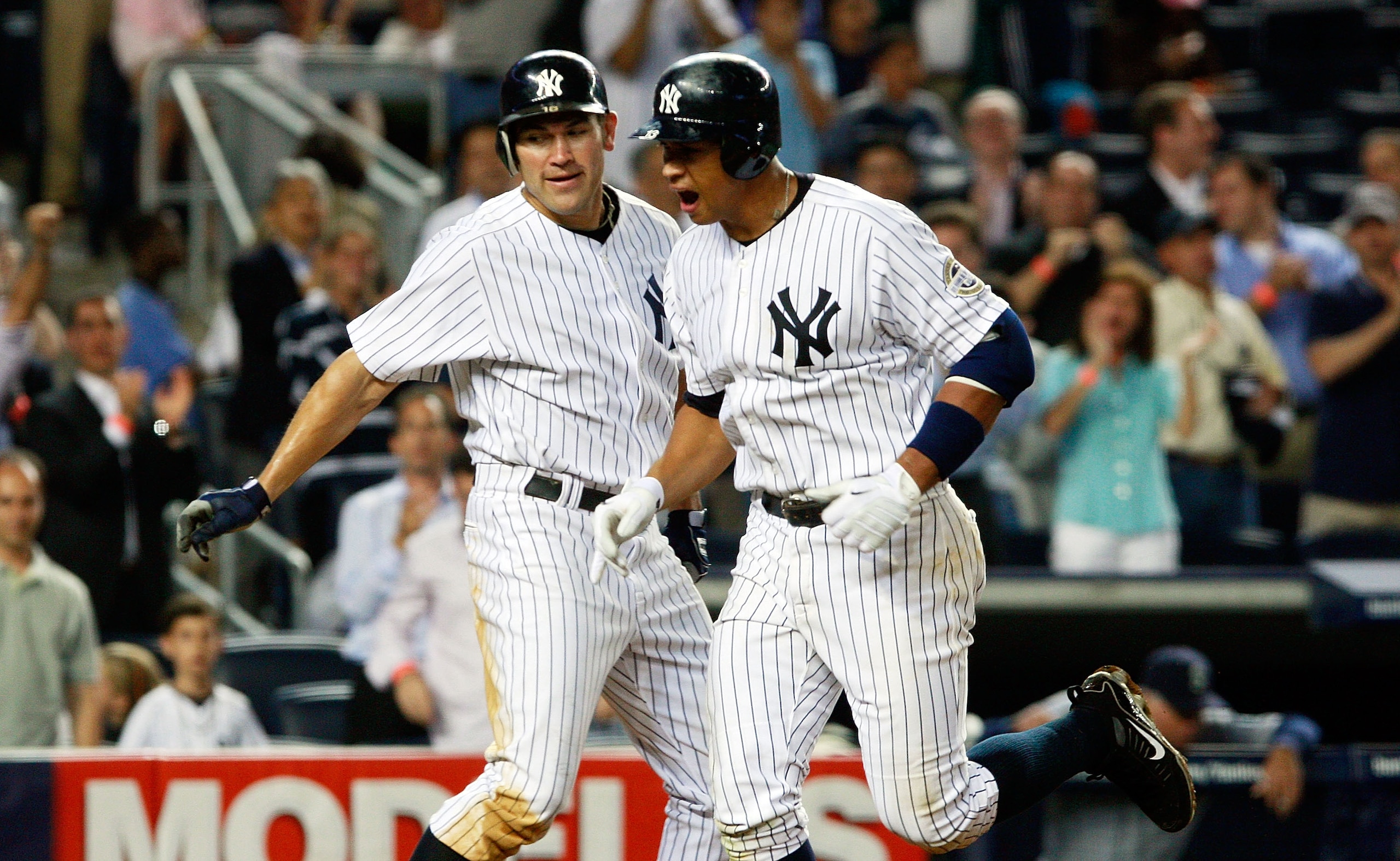 NEW YORK - JUNE 30:  Alex Rodriguez #13 of the New York Yankees (R) celebrates after hitting a home run in the seventh inning with teammate Johnny Damon #18 against the Seattle Mariners June 30, 2009 at Yankee Stadium in the Bronx borough of New York City