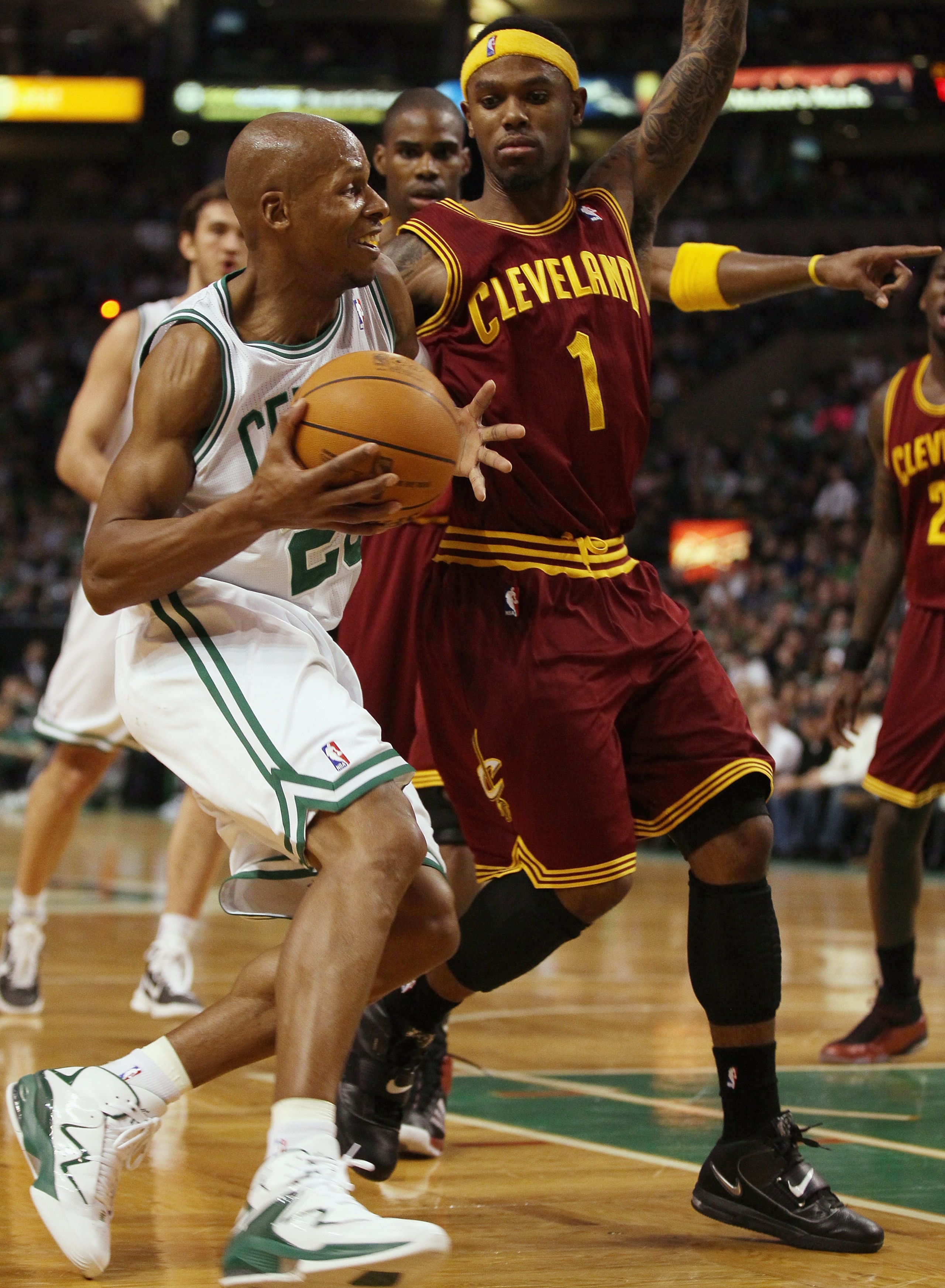 BOSTON, MA - JANUARY 25:  Ray Allen #20 of the Boston Celtics drives past Daniel Gibson #1  of the of the Cleveland Cavaliers on January 25, 2011 at the TD Garden in Boston, Massachusetts. The Celtics defeated the Cavaliers 112-95.  NOTE TO USER: User exp
