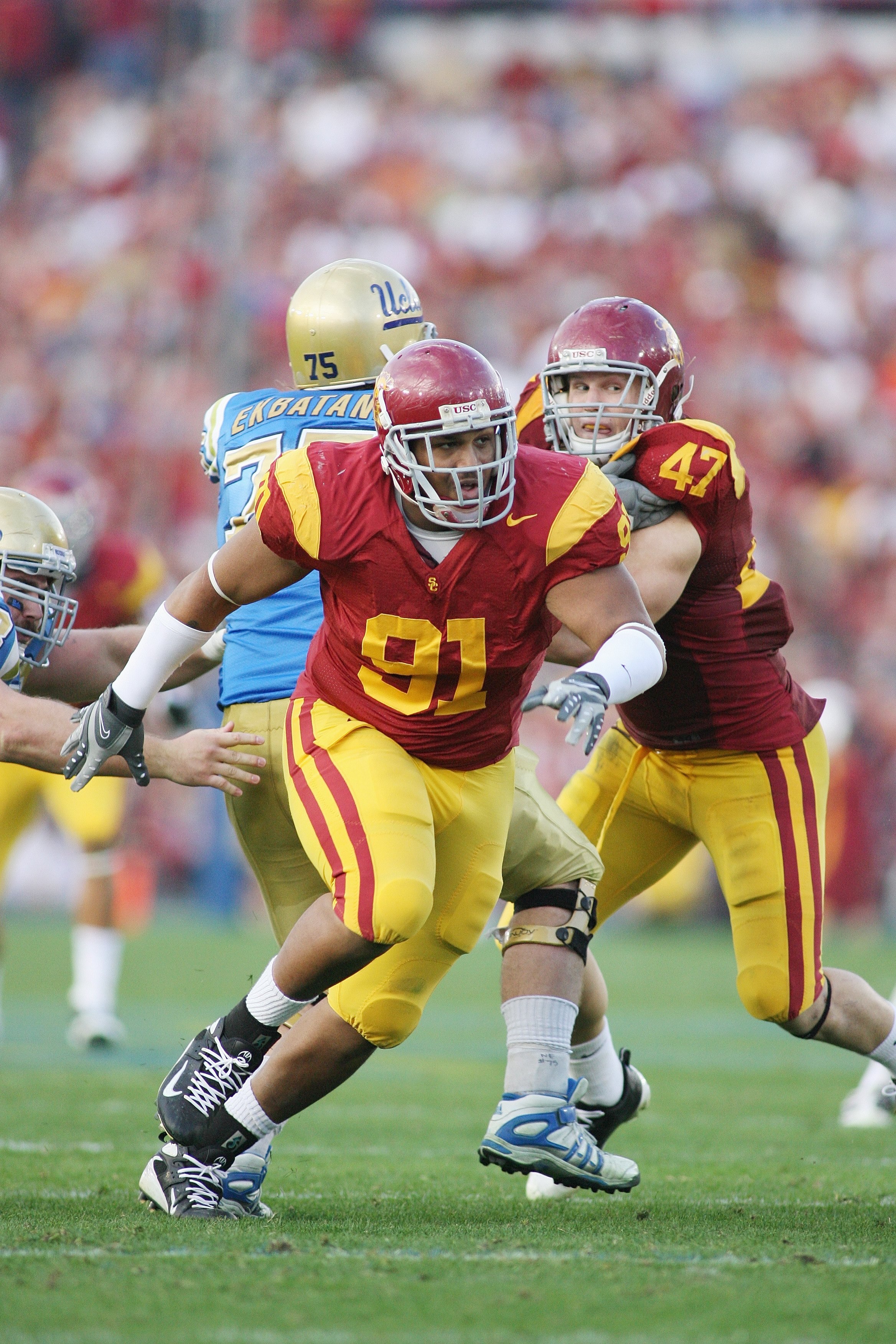 PASADENA, CA - DECEMBER 6:  Jurrell Casey #91 of the USC Trojans rushes against the UCLA Bruins on December 6, 2008 at the Rose Bowl in Pasadena, California.  USC won 28-7.  (Photo by Jeff Golden/Getty Images)