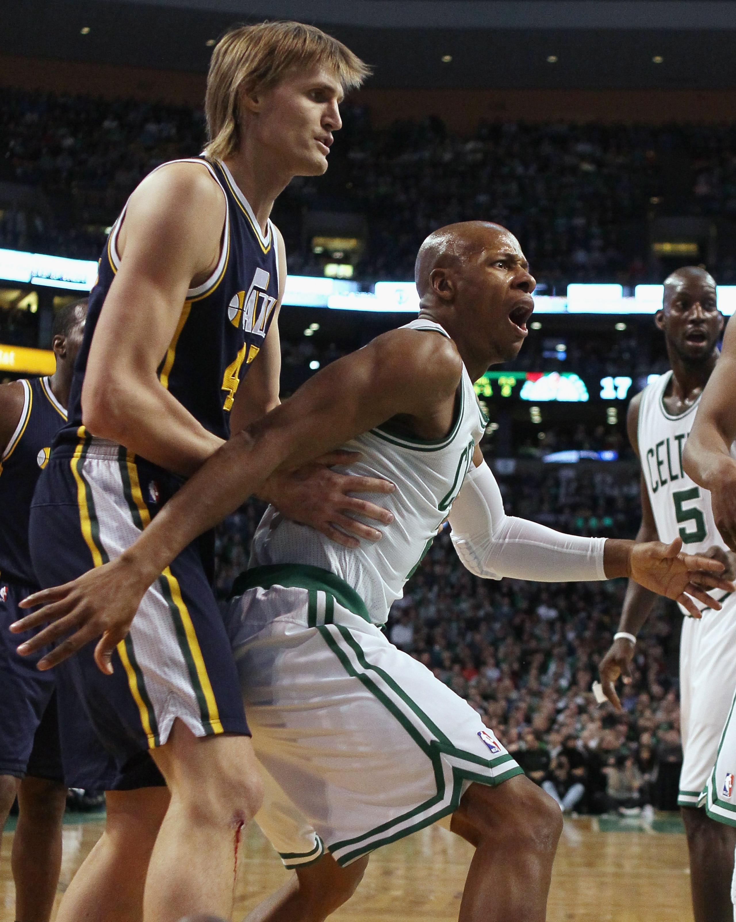 BOSTON, MA - JANUARY 21:  Ray Allen #20 of the Boston Celtics reacts after he is called for a foul as Andrei Kirilenko #47 of the Utah Jazz stands by on January 21, 2011 at the TD Garden in Boston, Massachusetts.  NOTE TO USER: User expressly acknowledges