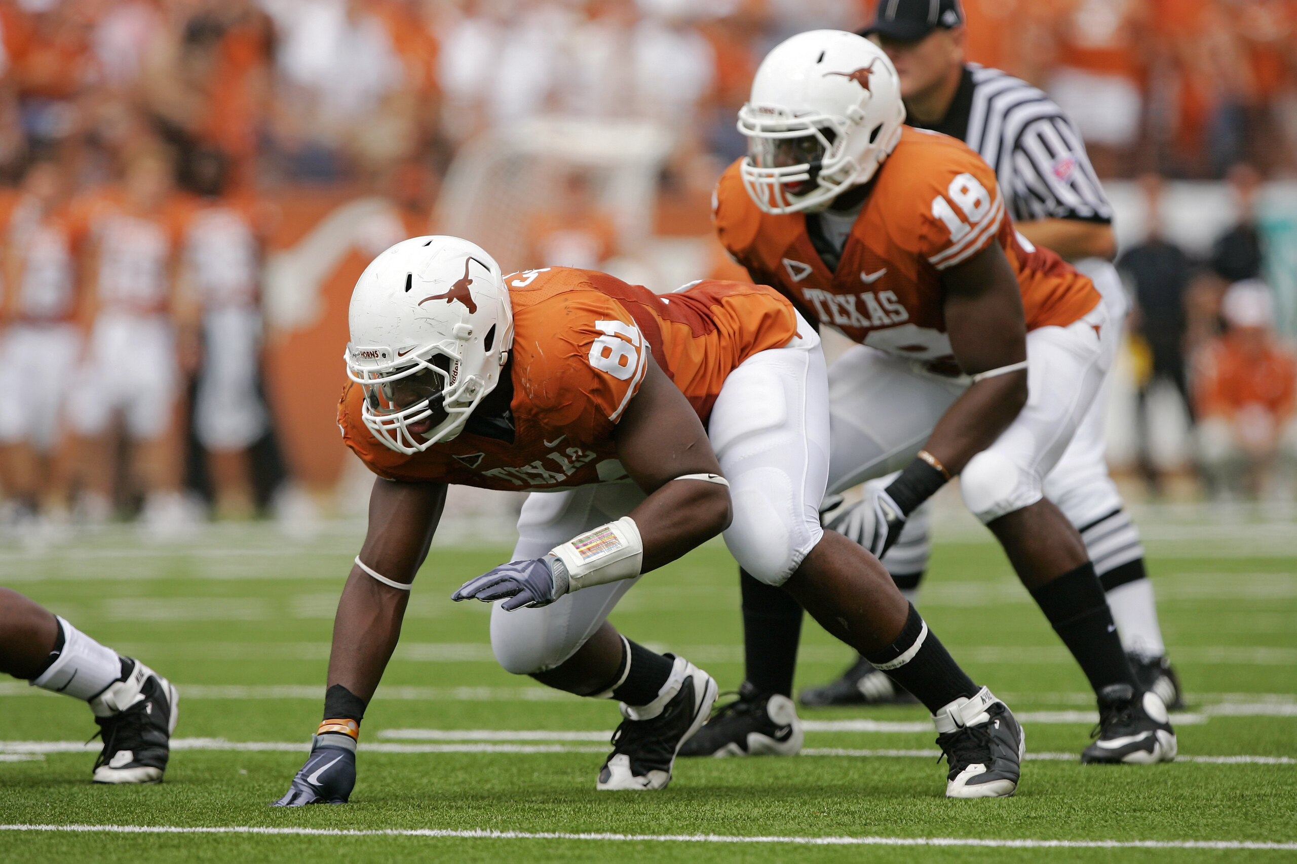 AUSTIN, TX - NOVEMBER 07:  Defensive end Sam Acho #81 and linebacker Emmanuel Acho #18 of the Texas Longhorns line up for a play against the UCF Knights on November 7, 2009 at Darrell K Royal - Texas Memorial Stadium in Austin, Texas.  Texas won 35-3.  (P