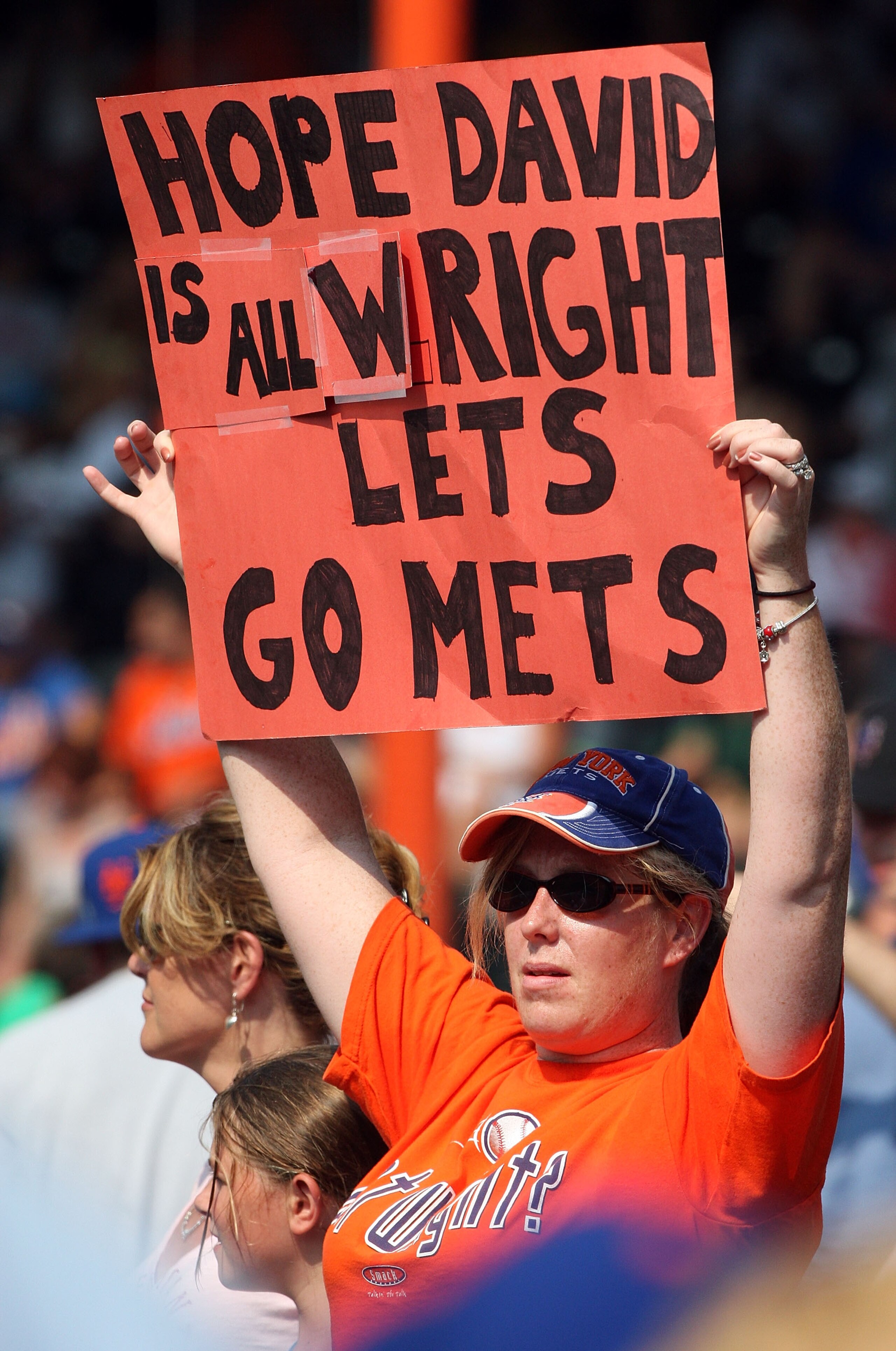 NEW YORK - AUGUST 16:  A fan of the New York Mets holds a banner in reference to injured player David Wright during the game against the San Francisco Giants on August 16, 2009 at Citi Field in the Flushing neighborhood of the Queens borough of New York C